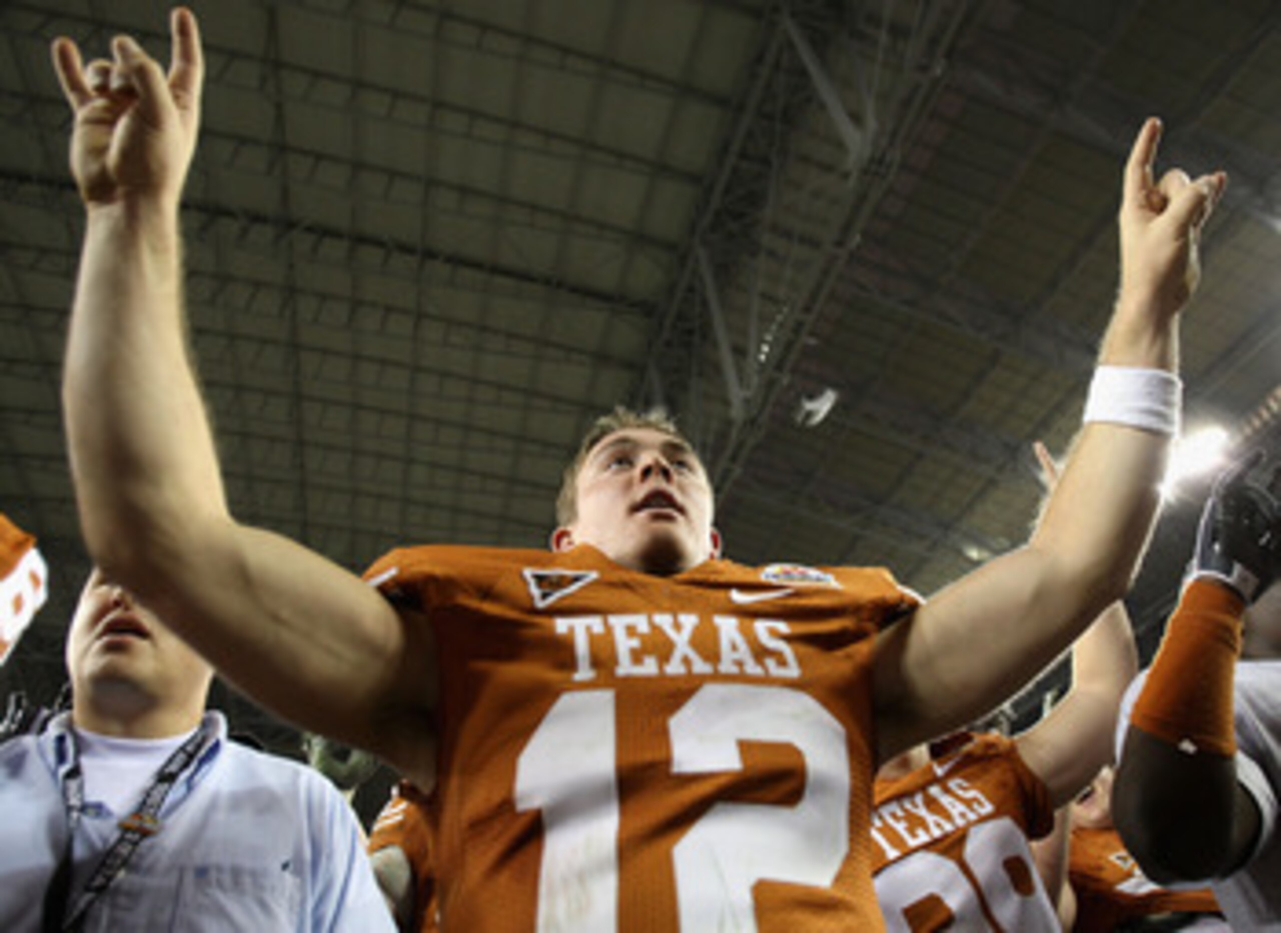 GLENDALE, AZ - JANUARY 05:  Quarterback Colt McCoy #12 of the Texas Longhorns celebrates after defeating the Ohio State Buckeyes in the Tostitos Fiesta Bowl Game on January 5, 2009 at University of Phoenix Stadium in Glendale, Arizona. The Longhorns defea