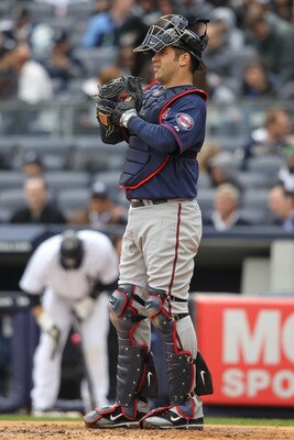 NEW YORK, NY - APRIL 07:  Joe Mauer #7 of the Minnesota Twins against New York Yankees at Yankee Stadium on April 7, 2011 in the Bronx borough of New York City.  (Photo by Nick Laham/Getty Images)