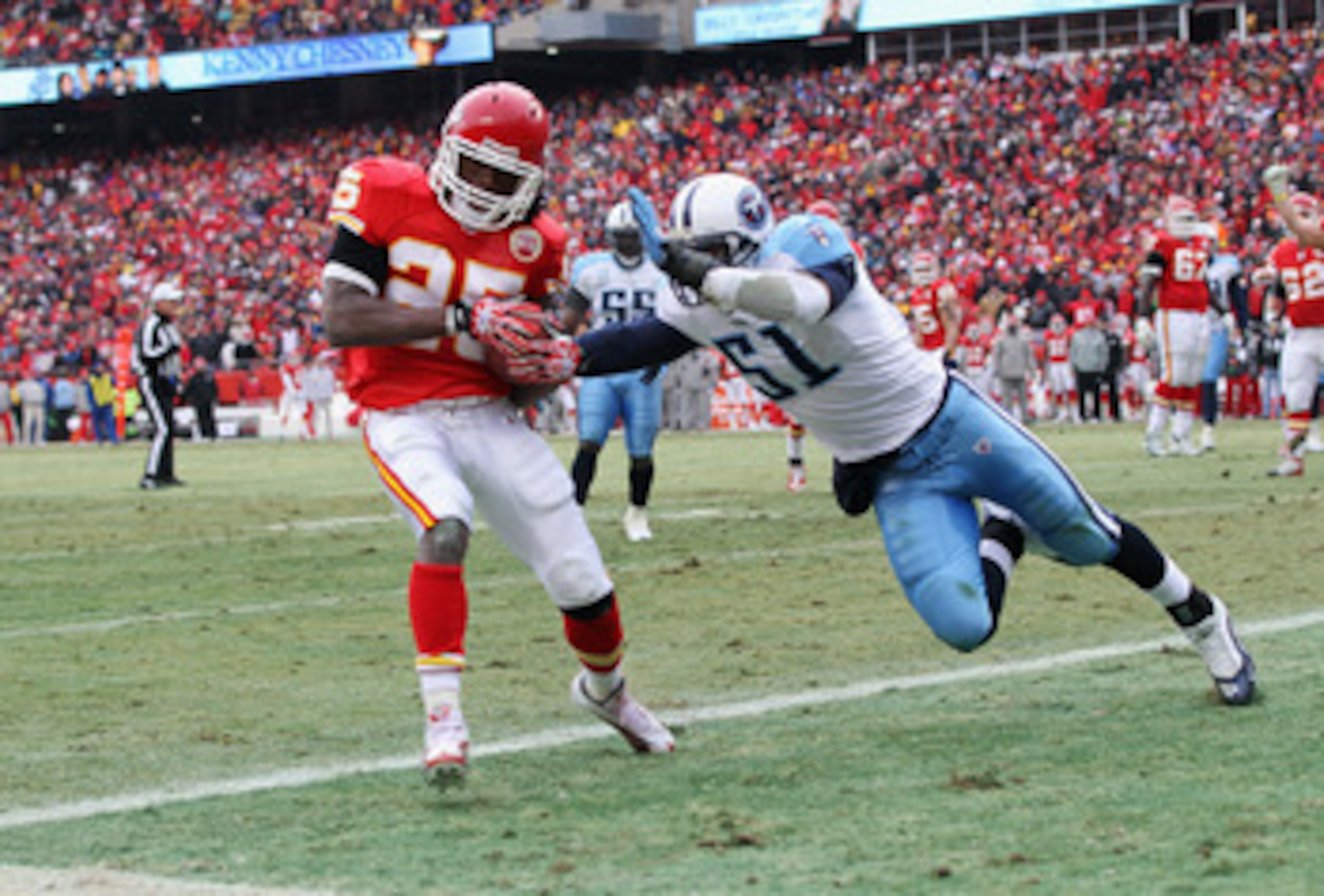 KANSAS CITY, MO - DECEMBER 26:  Jamaal Charles #25 of the Kansas City Chiefs makes a catch in the endzone for a touchdown as Gerald McRath #51 of the Tennessee Titans defends during the game on December 26, 2010 at Arrowhead Stadium in Kansas City, Missou