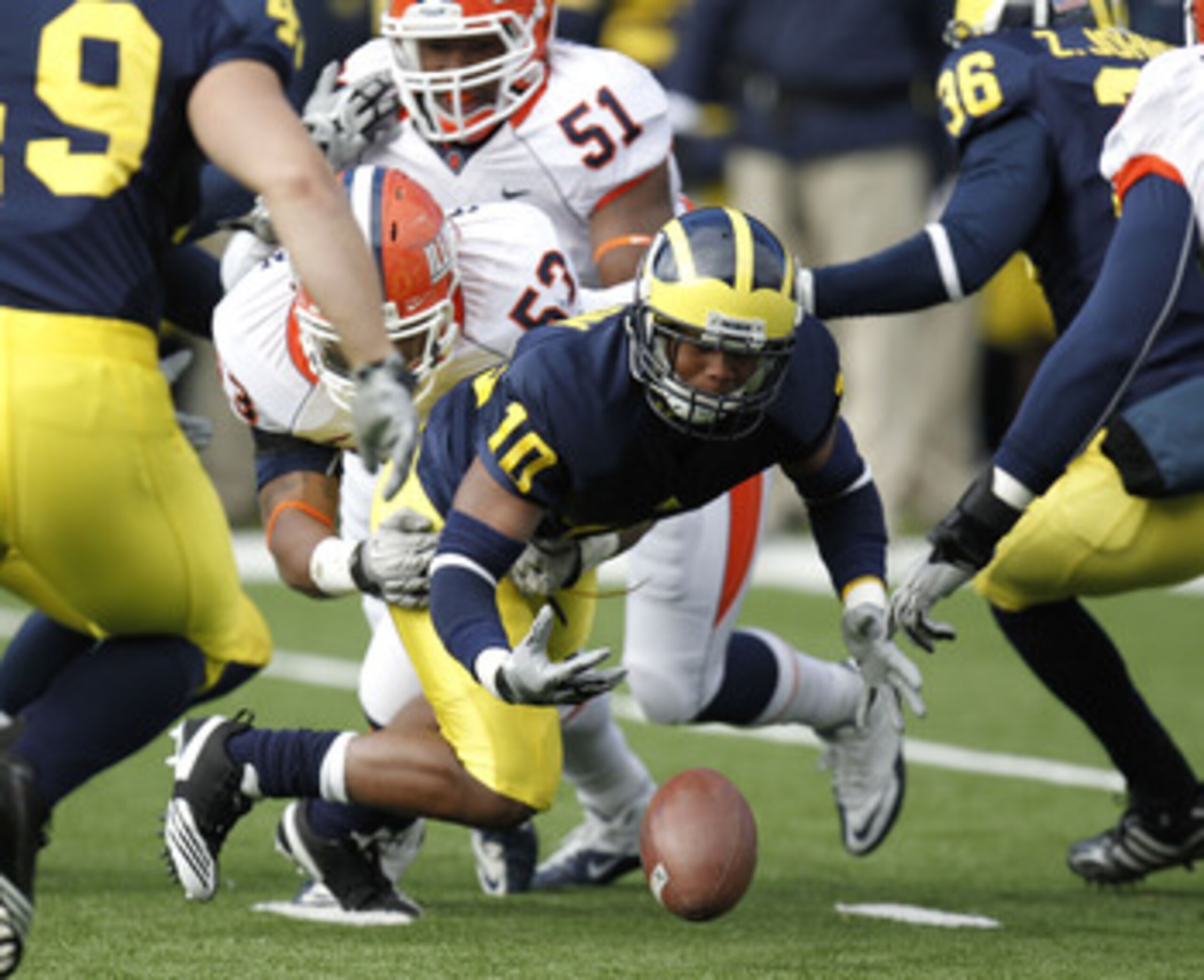 ANN ARBOR, MI - NOVEMBER 06:  Jeremy Gallon #10 of the Michigan Wolverines fumbles a kickoff return after being hit by Dustin Jefferson #53 of the Illinios Fighting Illini at Michigan Stadium on November 6, 2010 in Ann Arbor, Michigan. Michigan won the ga