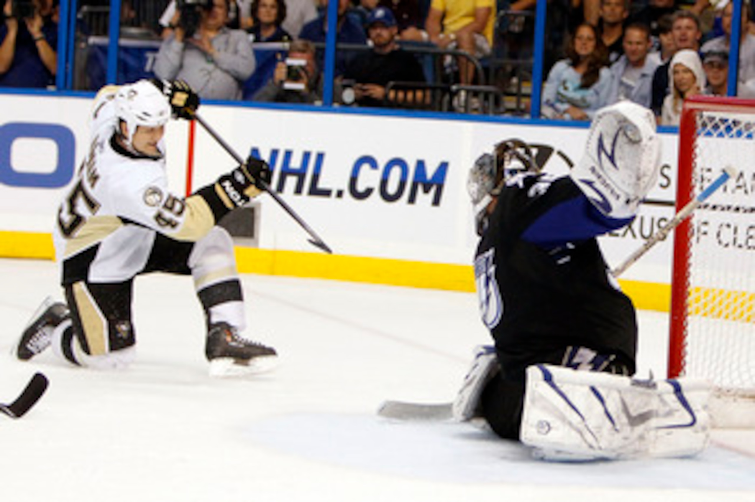 TAMPA, FL - APRIL 18: Arron Asham #45 of the Pittsburgh Penguins shoots and scores against Goaltender Dwayne Roloson #35 of the Tampa Bay Lightning in Game Three of the Eastern Conference Quarterfinals during the 2011 NHL Stanley Cup Playoffs at the St. P TAMPA, FL - APRIL 18: Arron Asham #45 of the Pittsburgh Penguins shoots and scores against Goaltender Dwayne Roloson #35 of the Tampa Bay Lightning in Game Three of the Eastern Conference Quarterfinals during the 2011 NHL Stanley Cup Playoffs at the St. P