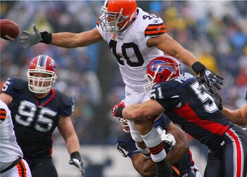 ORCHARD PARK, NY - DECEMBER 12:  Peyton Hillis #40 of the Cleveland Browns fumbles as he tries to jump over Paul Posluszny #51 of the Buffalo Bills at Ralph Wilson Stadium on December 12, 2010 in Orchard Park, New York. Buffalo won 13-6.  (Photo by Rick S
