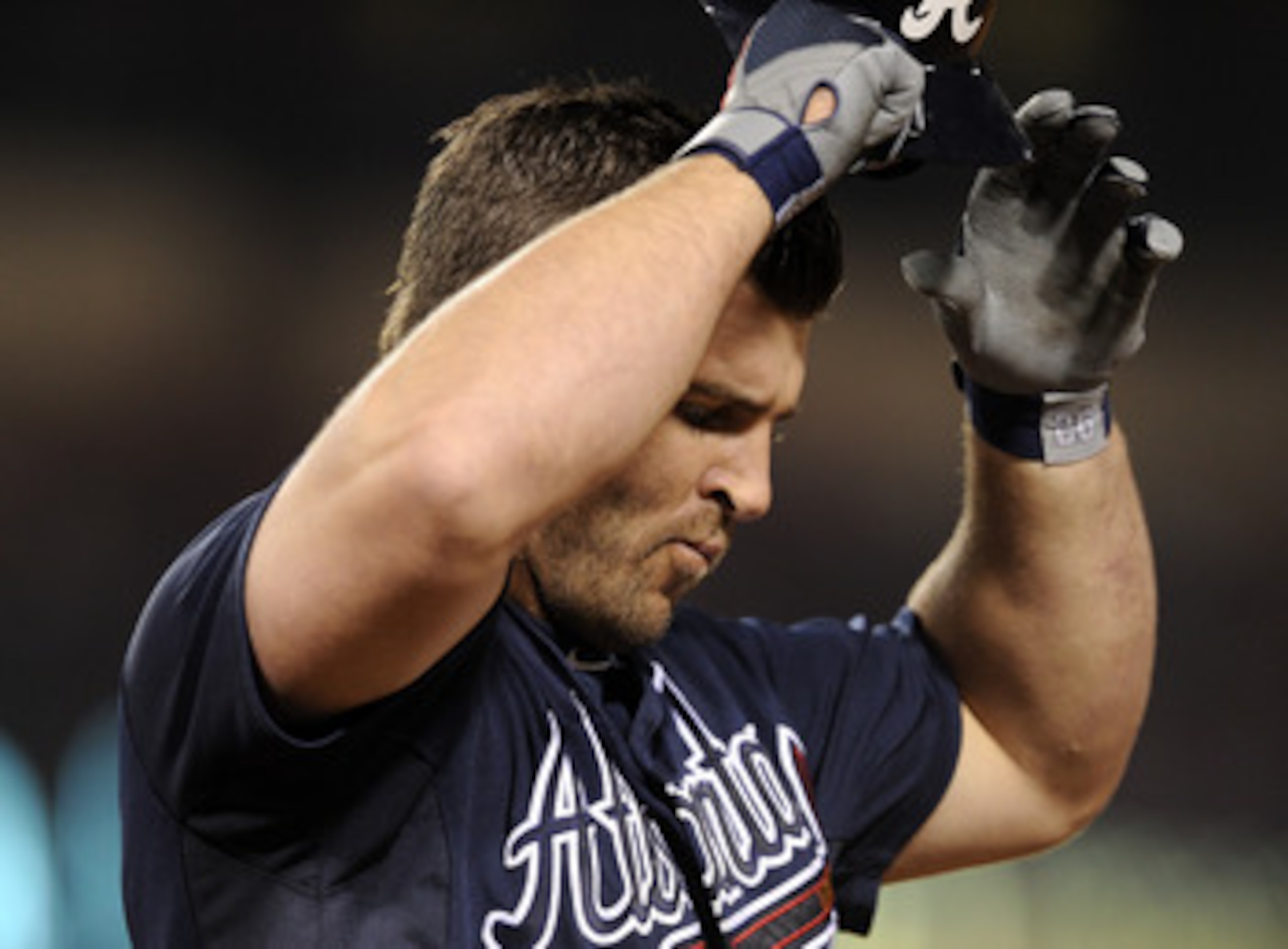 ANAHEIM, CA - MAY 21:  Dan Uggla #26 of the Atlanta Braves reacts as he grounds out with men in scoring position against the Los Angeles Angels during the sixth inning at Angel Stadium on May 21, 2011 in Anaheim, California.  (Photo by Harry How/Getty Ima