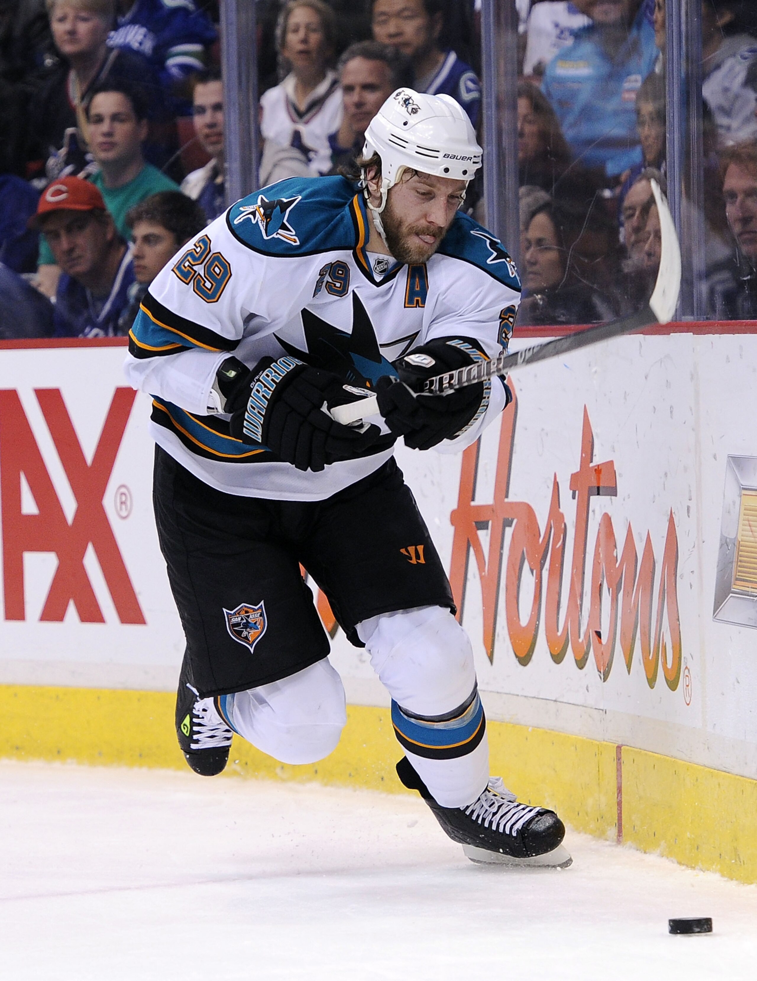 VANCOUVER, CANADA - MAY 24:  Ryane Clowe #29 of the San Jose Sharks plays the puck along the end boards in Game Five of the Western Conference Finals against the Vancouver Canucks during the 2011 Stanley Cup Playoffs at Rogers Arena on May 24, 2011 in Van