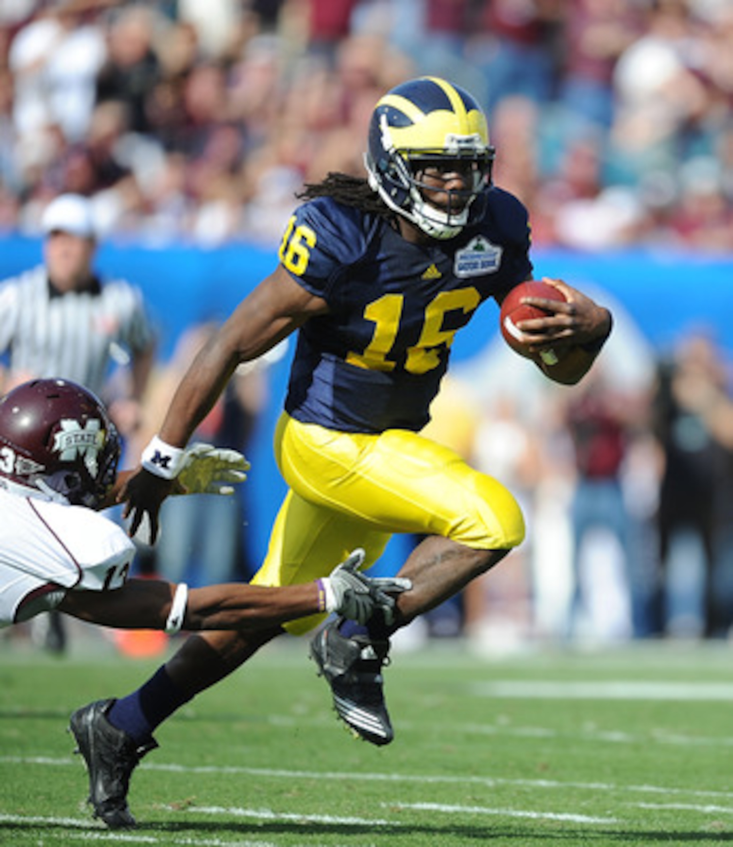 JACKSONVILLE, FL - JANUARY 01: Quarterback Denard Robinson #16 of the Michigan Wolverines rushes against the Mississippi State Bulldogs during the Gator Bowl at EverBank Field on January 1, 2011 in Jacksonville, Florida (Photo by Rick Dole/Getty Images) JACKSONVILLE, FL - JANUARY 01: Quarterback Denard Robinson #16 of the Michigan Wolverines rushes against the Mississippi State Bulldogs during the Gator Bowl at EverBank Field on January 1, 2011 in Jacksonville, Florida (Photo by Rick Dole/Getty Images)