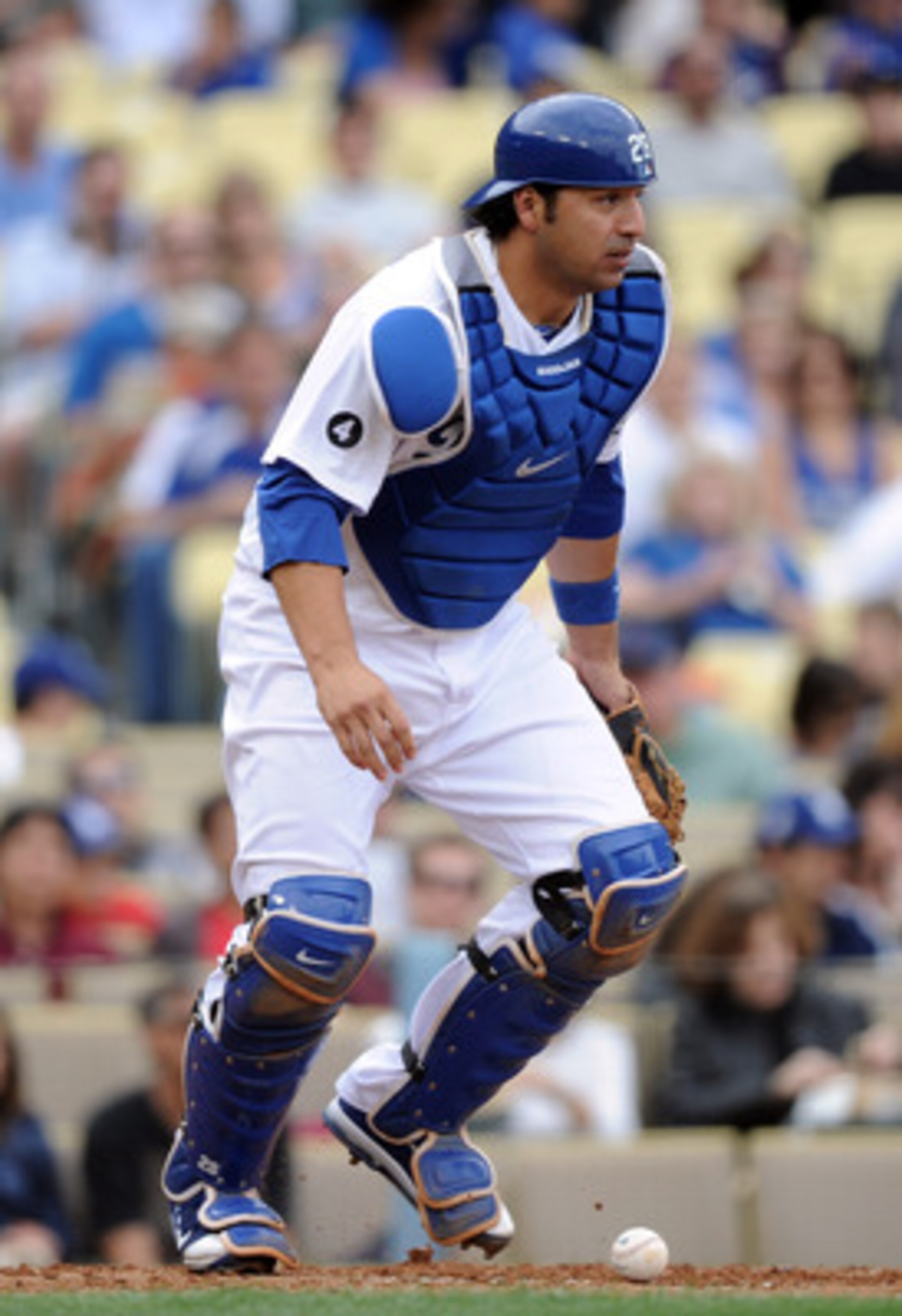 LOS ANGELES, CA - MAY 14: Rod Barajas #28 of the Los Angeles Dodgers keeps his eye on the base runners after a blocked wild pitch against the Arizona Diamondbacks at Dodger Stadium on May 14, 2011 in Los Angeles, California.  (Photo by Harry How/Getty Ima