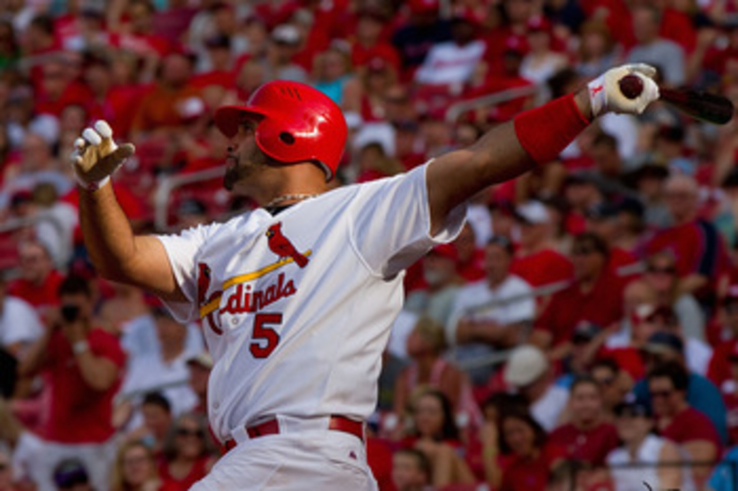 ST. LOUIS, MO - MAY 30: Albert Pujols #5 of the St. Louis Cardinals hits a solo home run against the San Francisco Giants at Busch Stadium on May 30, 2011 in St. Louis, Missouri.  (Photo by Dilip Vishwanat/Getty Images)
