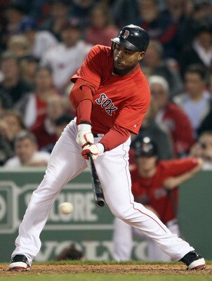 BOSTON, MA - MAY 20:  Carl Crawford #13 of the Boston Red Sox hits a 2RBI single on May 20, 2011 at Fenway Park in Boston, Massachusetts.on May 20, 2011 at Fenway Park in Boston, Massachusetts. The Chicago Cubs and the Boston Red Sox have not played at Fe