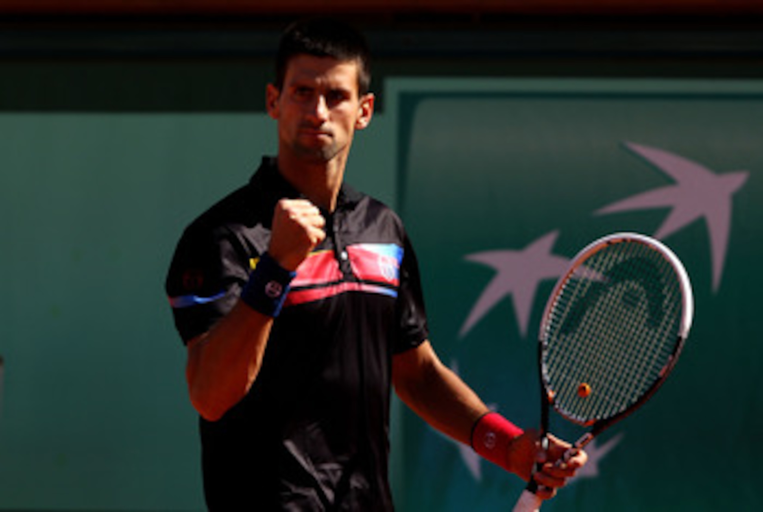 PARIS, FRANCE - MAY 25:  Novak Djokovic of Serbia celebrates a point during the men's singles round two match between Victor Hanescu of Romania and Novak Djokovic of Serbia on day four of the French Open at Roland Garros on May 25, 2011 in Paris, France. 