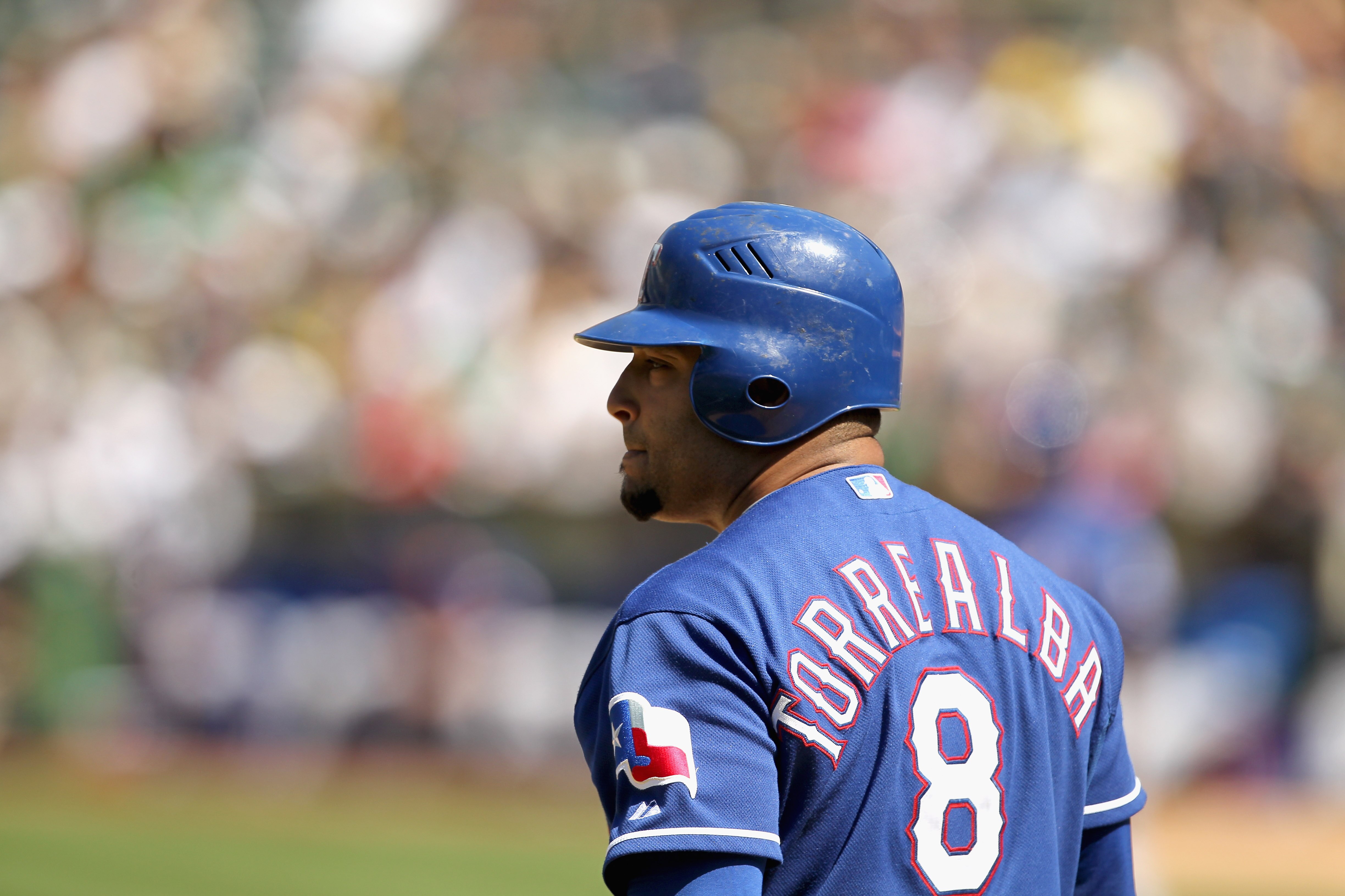 OAKLAND, CA - APRIL 30:  Yorvit Torrealba #8 of the Texas Rangers in action during their game against the Oakland Athletics at Oakland-Alameda County Coliseum on April 30, 2011 in Oakland, California.  (Photo by Ezra Shaw/Getty Images)