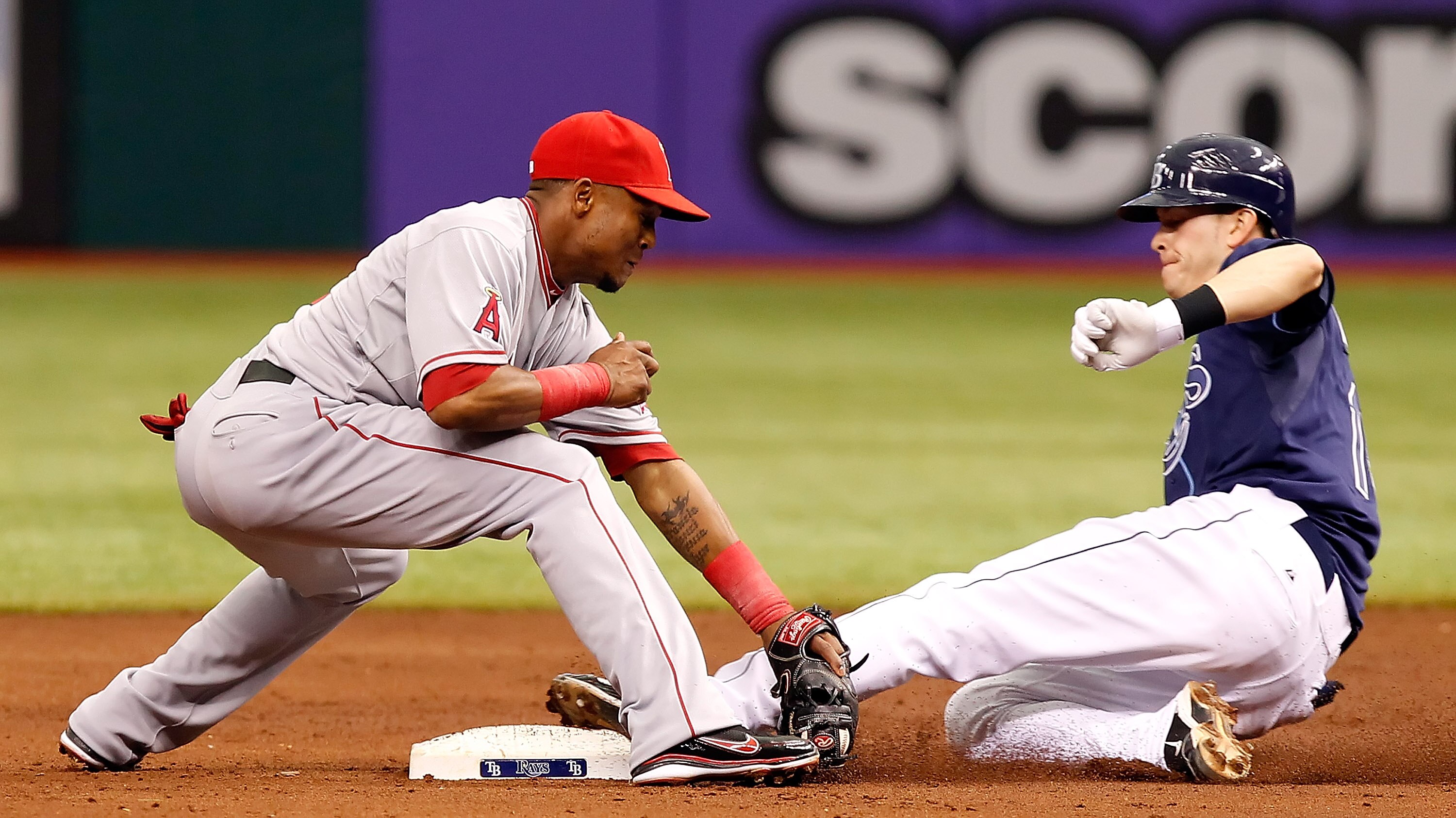 ST PETERSBURG, FL - APRIL 30:  Shortstop Erick Aybar #2 of the Los Angeles Angels of Anaheim applies the tag to Reid Brignac #15 of the Tampa Bay Rays as he tried to advance to second during the game at Tropicana Field on April 30, 2011 in St. Petersburg,