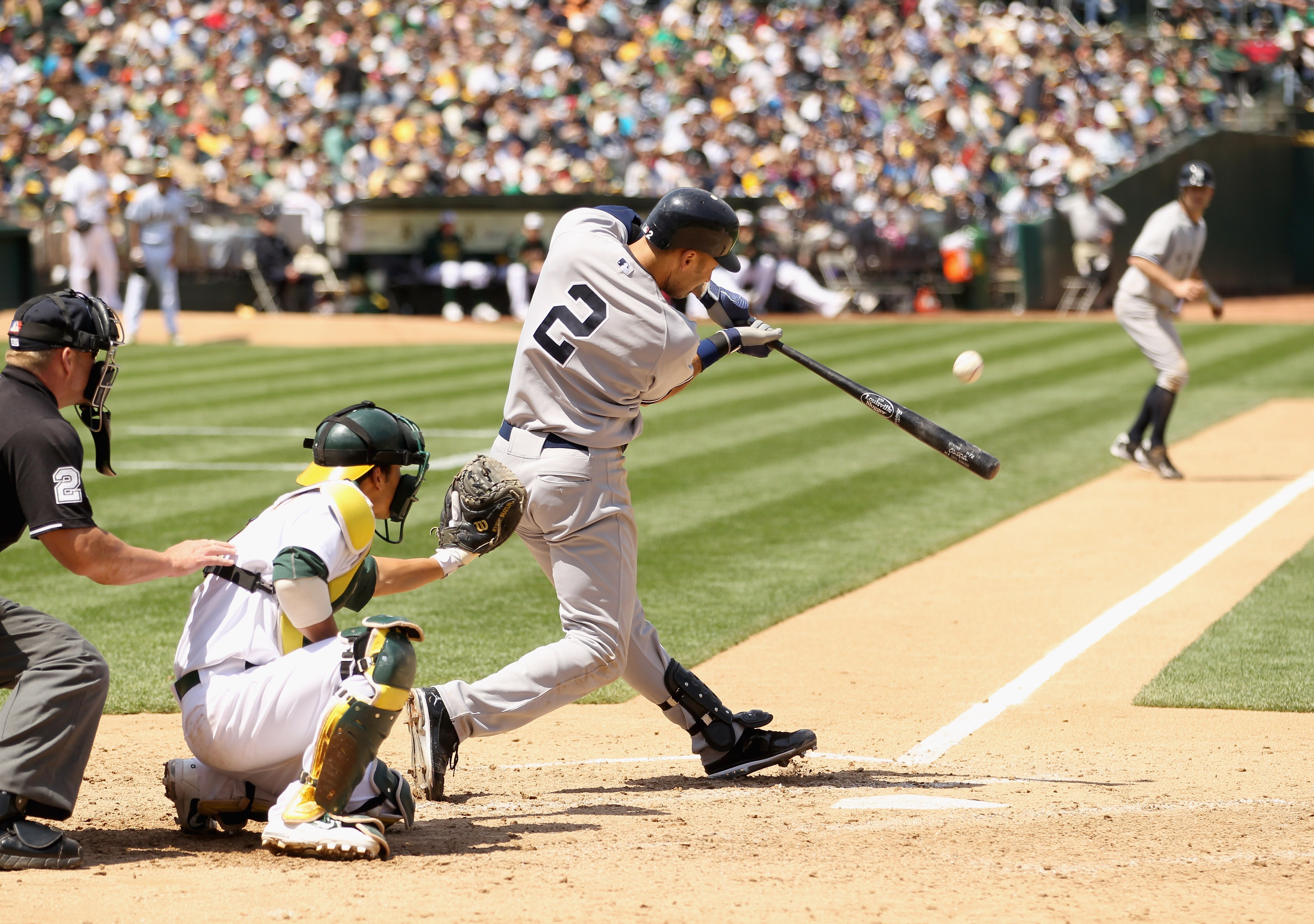 OAKLAND, CA - MAY 30:  Derek Jeter #2 of the New York Yankees hits a sacrifice fly in the seventh inning that scored Brett Gardner #11 of the New York Yankees during their game against the Oakland Athletics at Oakland-Alameda County Coliseum on May 30, 20