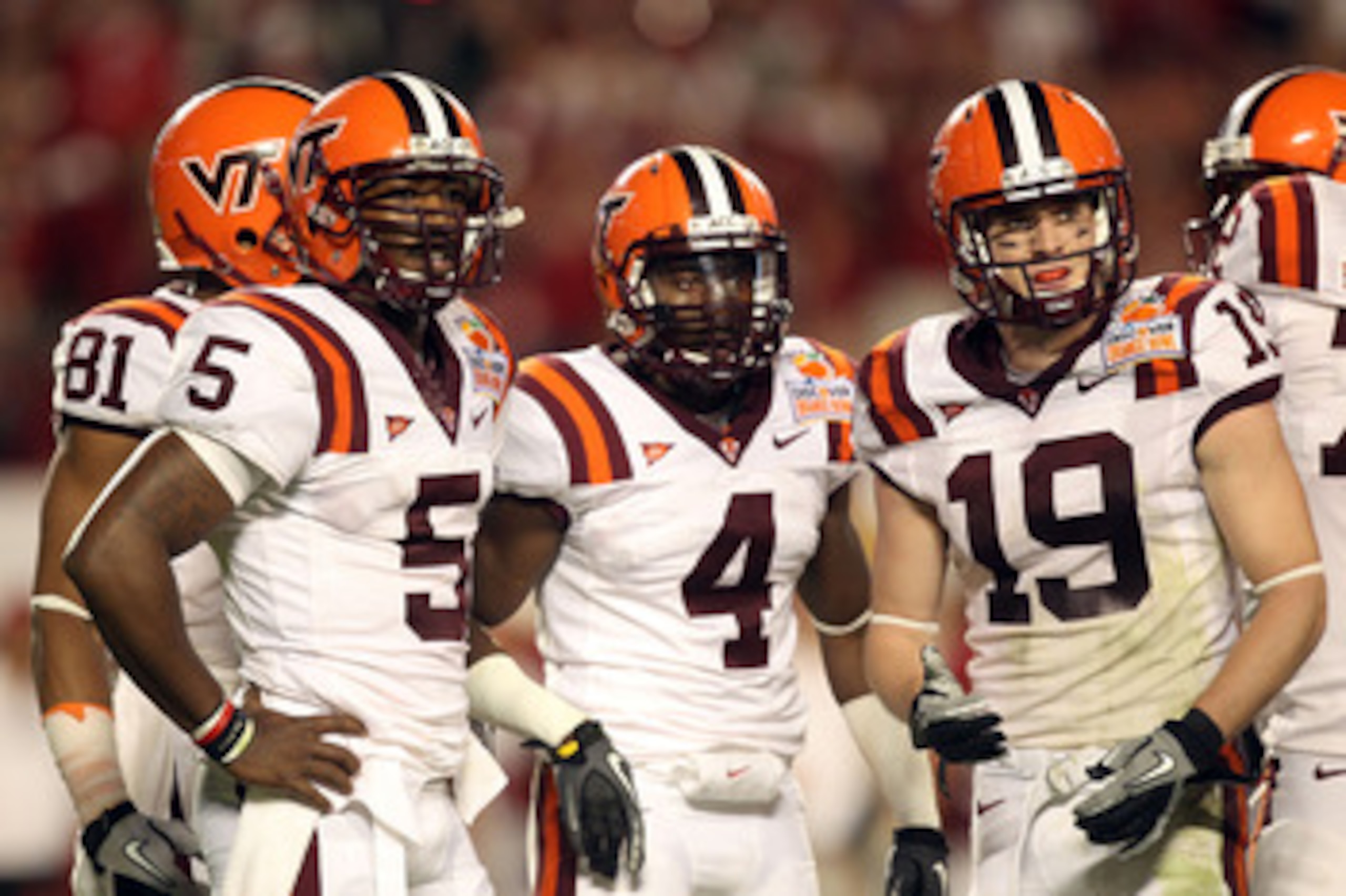MIAMI, FL - JANUARY 03:  (L-R) Tyrod Taylor #5, David Wilson #4 and Danny Coale #19 of the Virginia Tech Hokies look towards the sideline against the Stanford Cardinal during the 2011 Discover Orange Bowl at Sun Life Stadium on January 3, 2011 in Miami, F