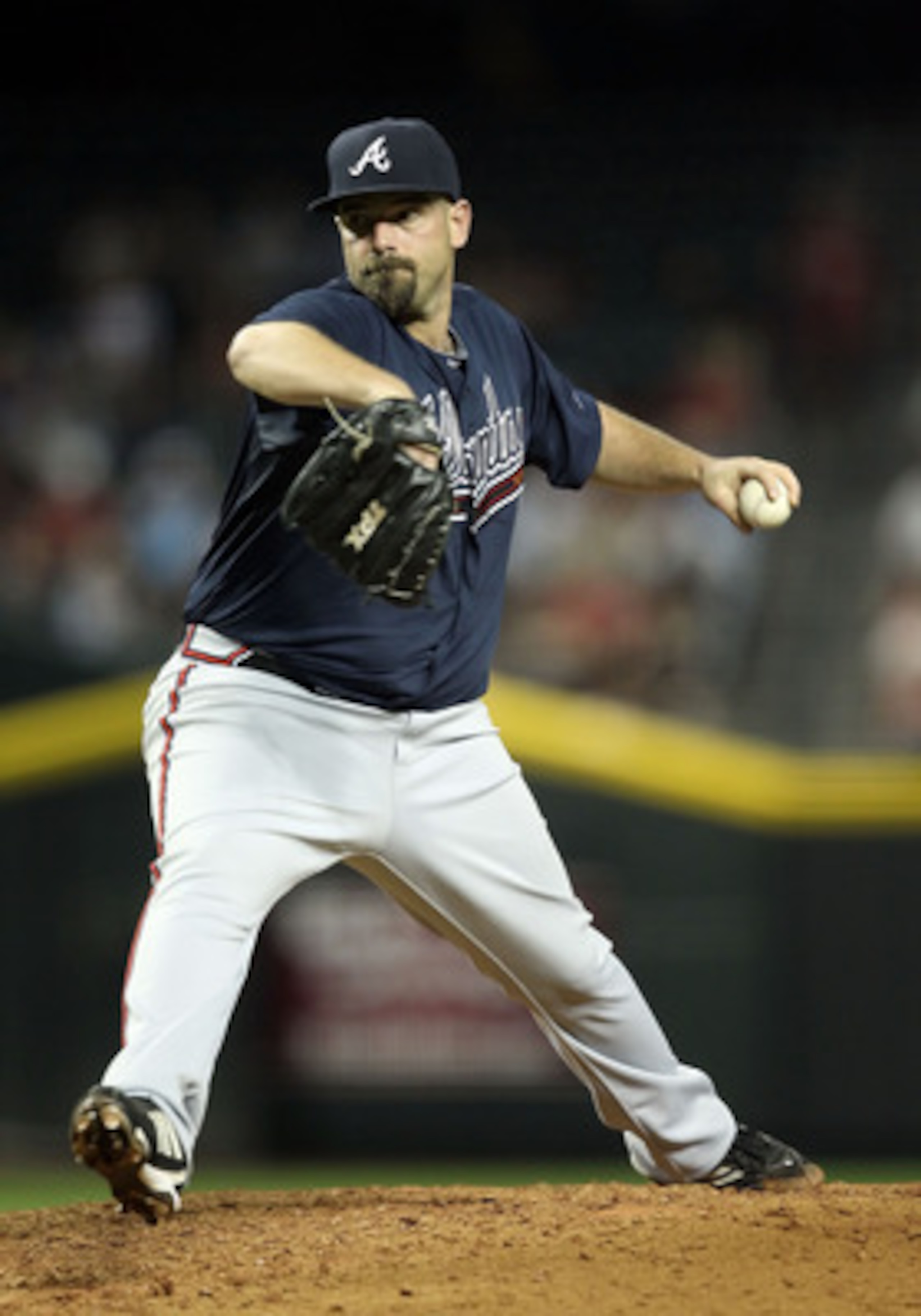 PHOENIX, AZ - MAY 18:  Relief pitcher George Sherrill #52 of the Atlanta Braves pitches against the Arizona Diamondbacks during the Major League Baseball game at Chase Field on May 18, 2011 in Phoenix, Arizona.  The Diamondbacks defeated the Braves 5-4 in