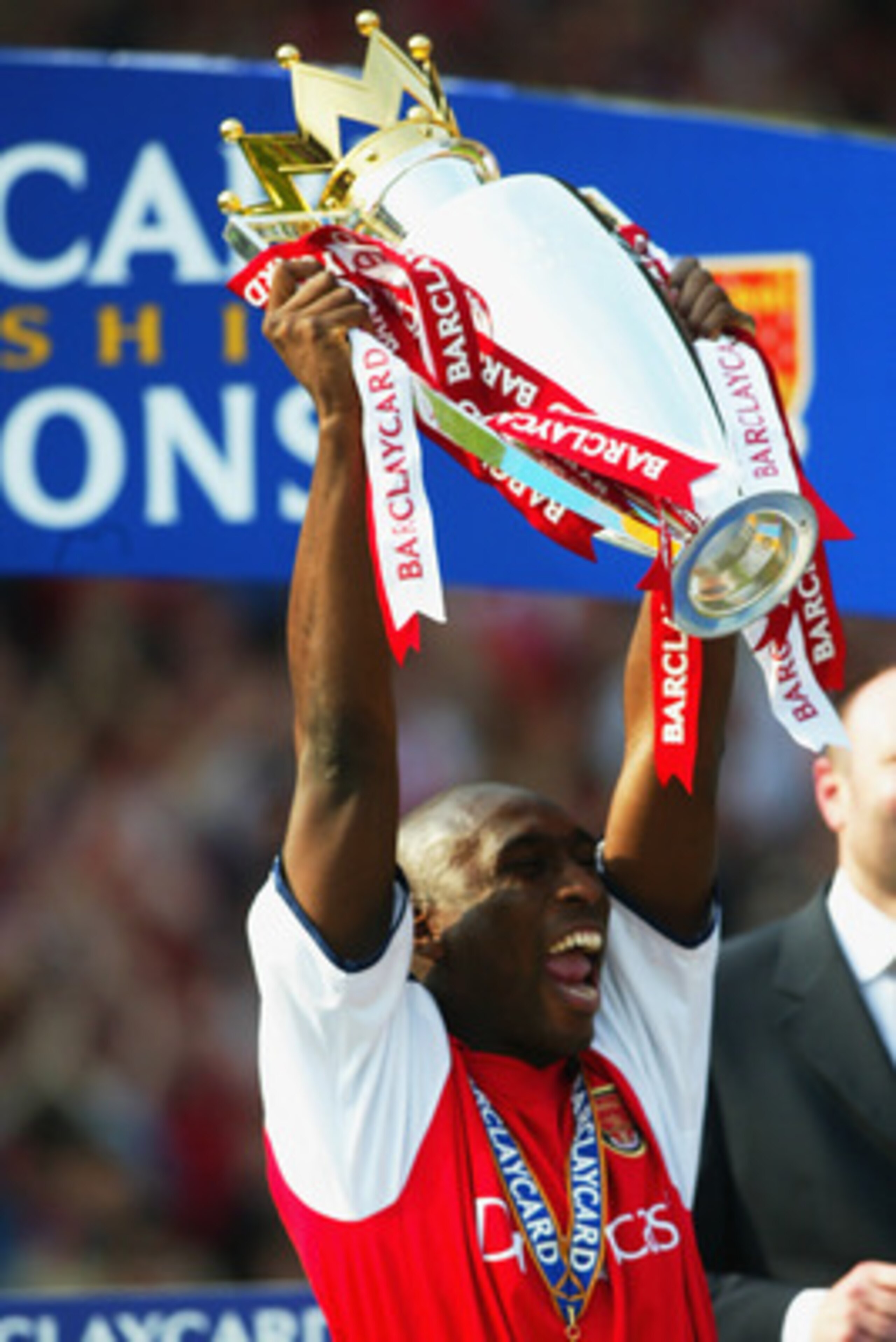 LONDON - MAY 11: Sol Campbell of Arsenal celebrates by lifting the Premiership trophy after the FA Barclaycard Premiership match between Arsenal and Everton played at Highbury, in London on May 11, 2002. Arsenal won the match 4-3. DIGITAL IMAGE. (Photo b LONDON - MAY 11: Sol Campbell of Arsenal celebrates by lifting the Premiership trophy after the FA Barclaycard Premiership match between Arsenal and Everton played at Highbury, in London on May 11, 2002. Arsenal won the match 4-3. DIGITAL IMAGE. (Photo b