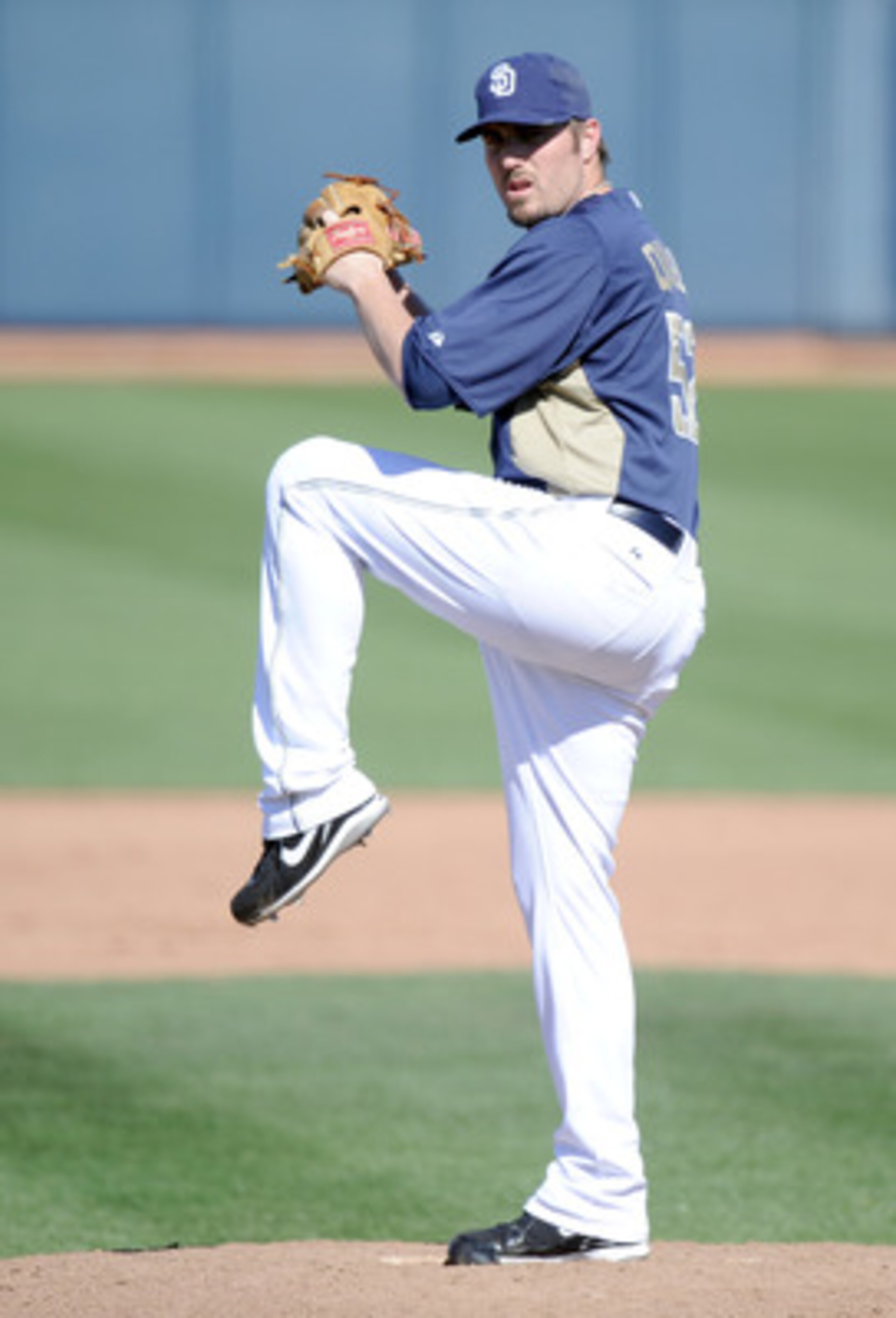 PEORIA, AZ - MARCH 02:  Chad Qualls #52 of the  San Diego Padres pitches against the Colorado Rockies during spring training at Peoria Stadium on March 2, 2011 in Peoria, Arizona.  (Photo by Harry How/Getty Images)