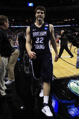 NEW ORLEANS, LA - MARCH 24:  Jimmer Fredette #32 of the Brigham Young Cougars walks off of the court rejected after their 74 to 83 loss to the Florida Gators in the Southeast regional of the 2011 NCAA men's basketball tournament at New Orleans Arena on Ma