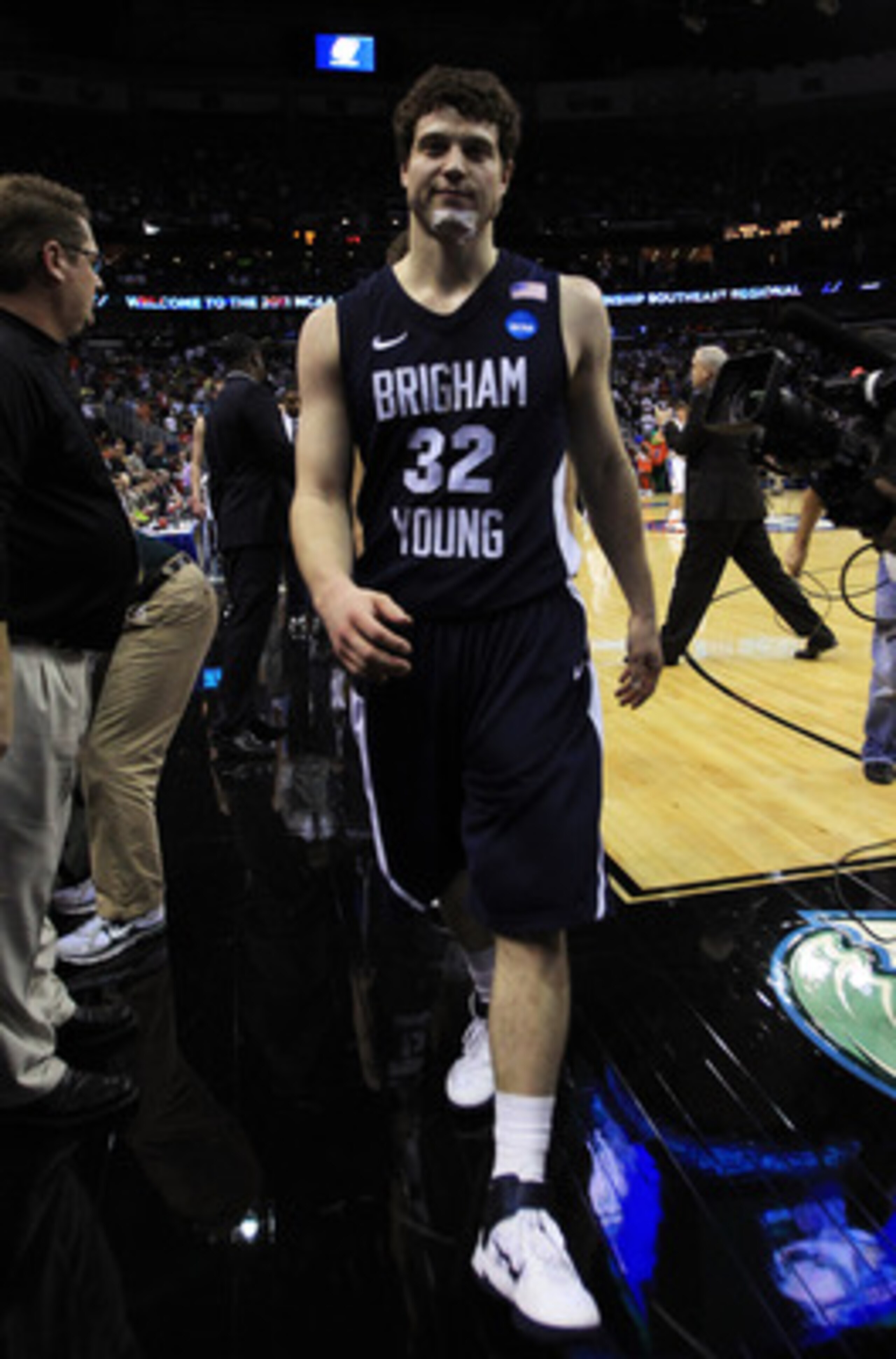 NEW ORLEANS, LA - MARCH 24:  Jimmer Fredette #32 of the Brigham Young Cougars walks off of the court rejected after their 74 to 83 loss to the Florida Gators in the Southeast regional of the 2011 NCAA men's basketball tournament at New Orleans Arena on Ma