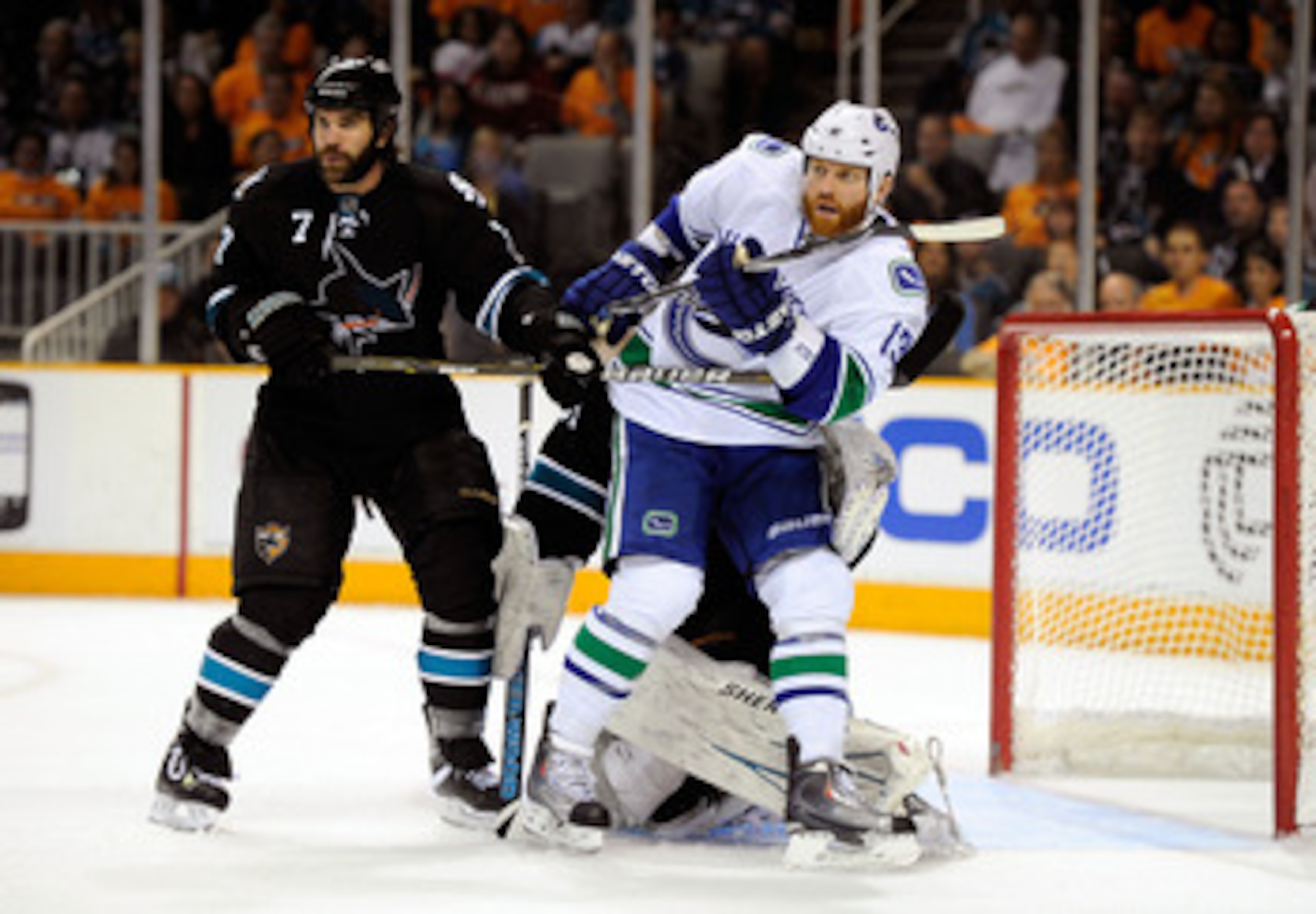 SAN JOSE, CA - MAY 20: Raffi Torres #13 of the Vancouver Canucks screens goaltender Antti Niemi #31 of the San Jose Sharks as Niclas Wallin #7 of the San Jose Sharks looks on in the second period in Game Three of the Western Conference Finals during the SAN JOSE, CA - MAY 20: Raffi Torres #13 of the Vancouver Canucks screens goaltender Antti Niemi #31 of the San Jose Sharks as Niclas Wallin #7 of the San Jose Sharks looks on in the second period in Game Three of the Western Conference Finals during the