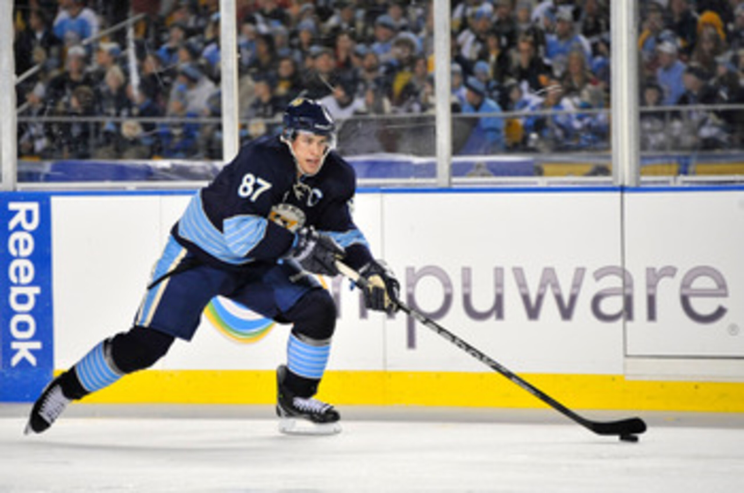 PITTSBURGH, PA - JANUARY 01:  Sidney Crosby #87 of the Pittsburgh Penguins looks to pass against the Washington Capitals during the 2011 NHL Bridgestone Winter Classic at Heinz Field on January 1, 2011 in Pittsburgh, Pennsylvania. Washington won 3-1. (Pho