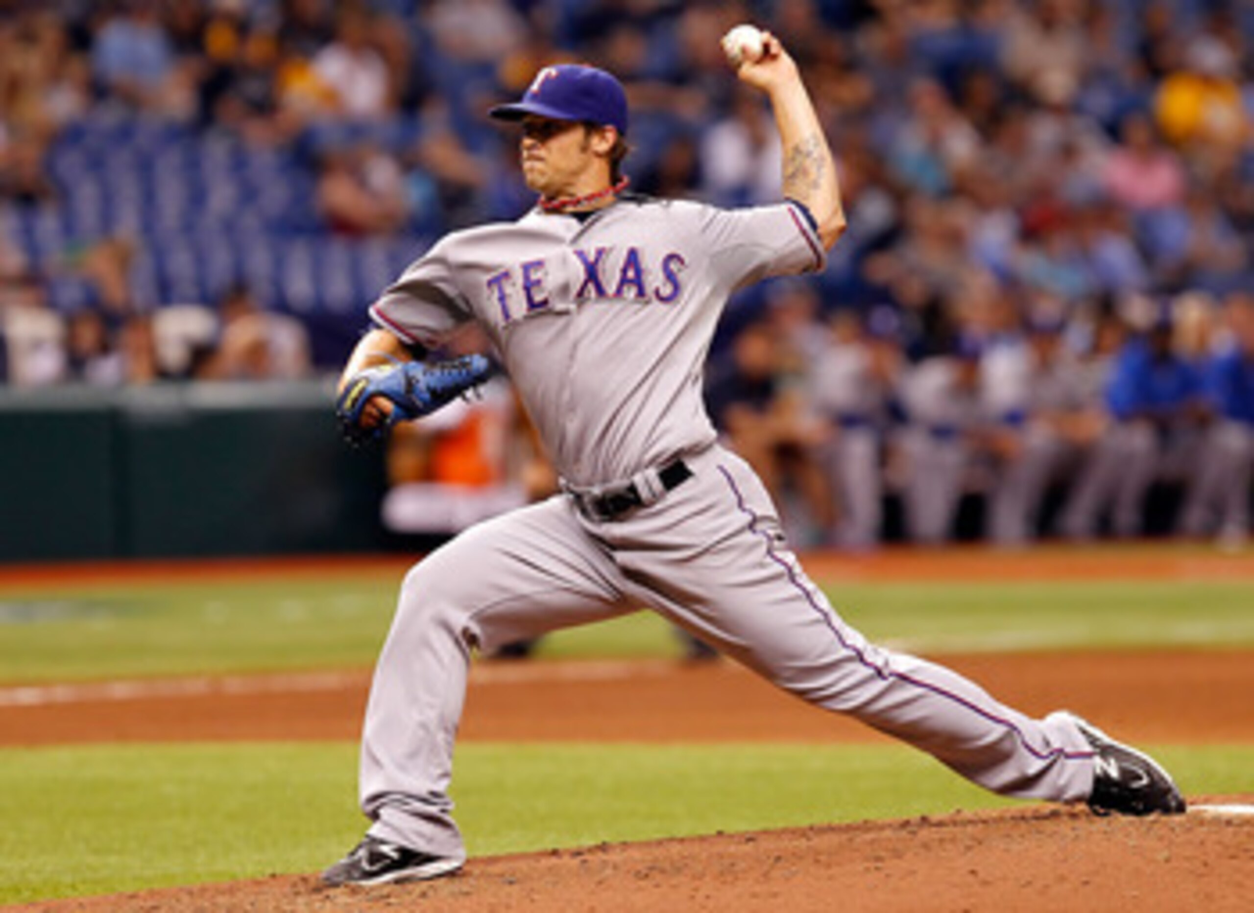 ST PETERSBURG, FL - MAY 31:  :  Pitcher C.J. Wilson #36 of the Texas Rangers pitches against the Tampa Bay Rays during the game at Tropicana Field on May 31, 2011 in St. Petersburg, Florida.  (Photo by J. Meric/Getty Images)