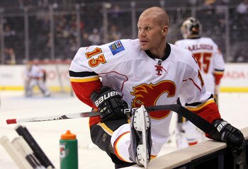 LOS ANGELES, CA - MARCH 21:  Olli Jokinen #13 of the Calgary Flames stretches during warm-up prior to their NHL game against the Los Angeles Kings at Staples Center on March 21, 2011 in Los Angeles, California. The Kings defeated the Flames 2-1 in shootou