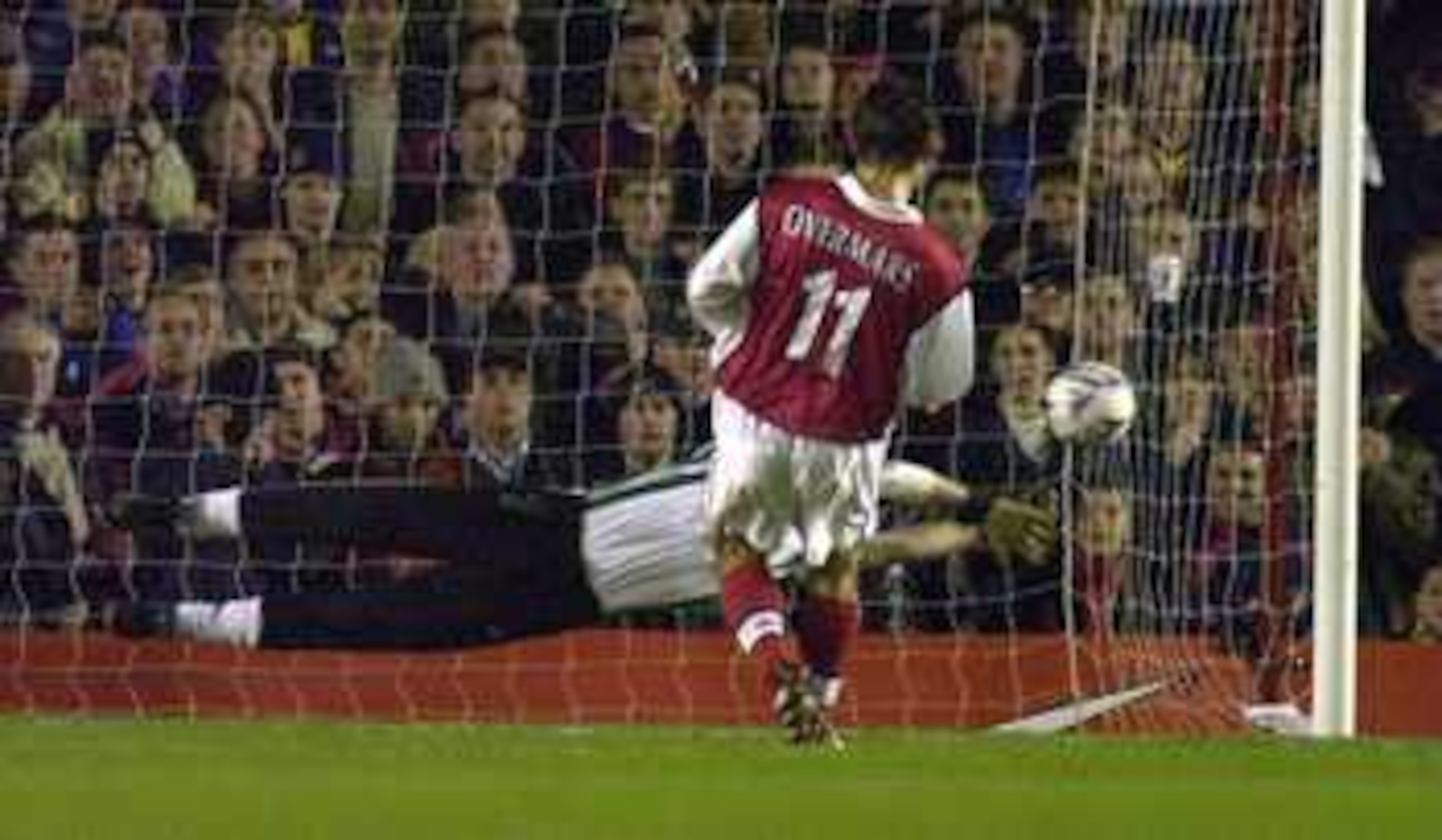 25 Nov 1999: Marc Overmars of Arsenal shoots the penalty past the Nantes goalkeeper to score the opening goal during the Arsenal v Nantes UEFA Cup Third Round First Leg match at Highbury, London. Mandatory Credit: Ross Kinnaird/ALLSPORT 25 Nov 1999: Marc Overmars of Arsenal shoots the penalty past the Nantes goalkeeper to score the opening goal during the Arsenal v Nantes UEFA Cup Third Round First Leg match at Highbury, London. Mandatory Credit: Ross Kinnaird/ALLSPORT