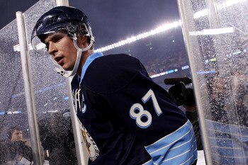 PITTSBURGH, PA - JANUARY 01:  Sidney Crosby #87 of the Pittsburgh Penguins walks off the ice after being defeated 3-1 by the Washington Capitals during the 2011 NHL Bridgestone Winter Classic at Heinz Field on January 1, 2011 in Pittsburgh, Pennsylvania.