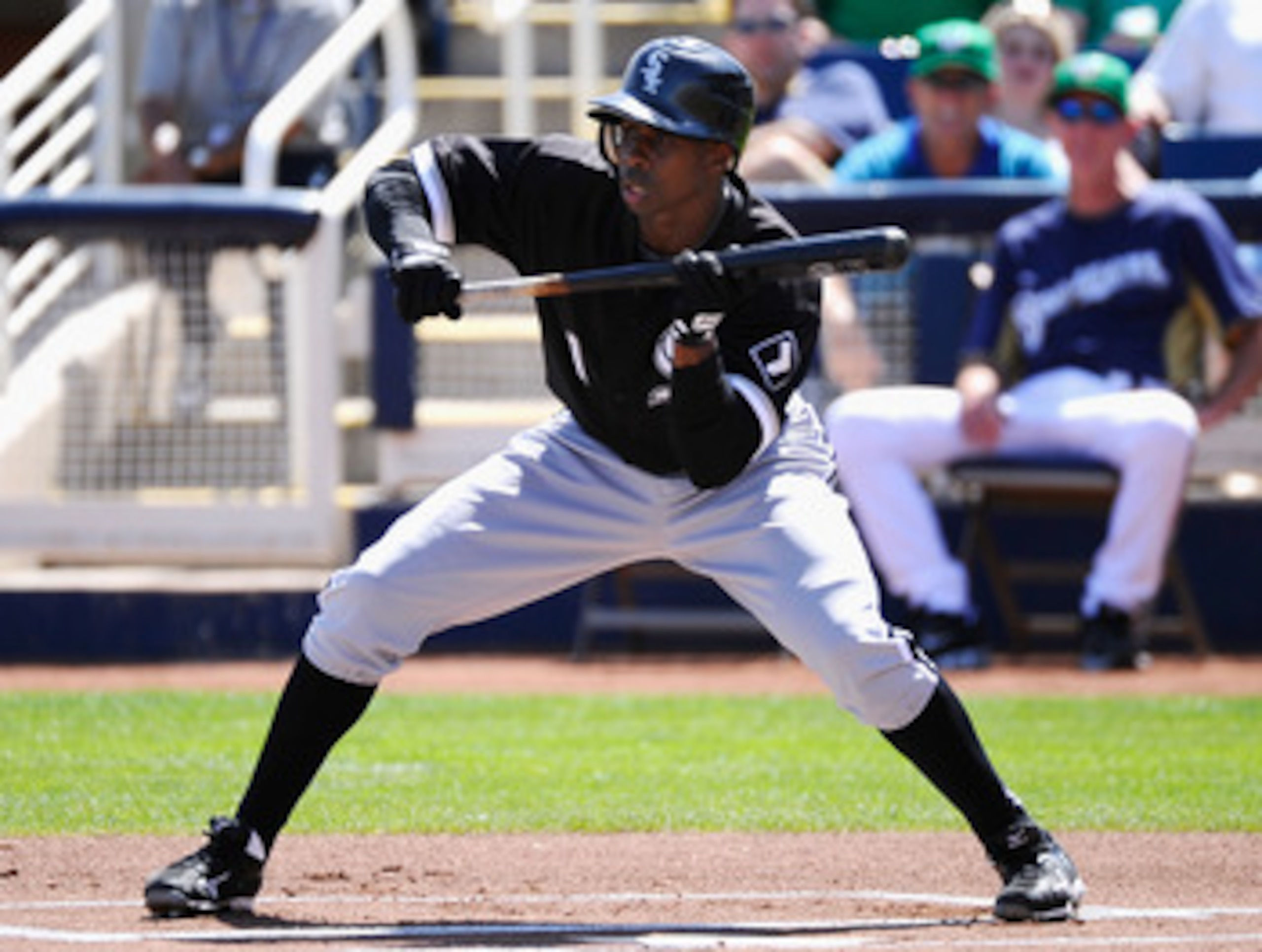 PHOENIX, AZ - MARCH 17: Juan Pierre #1 of the Chicago White Sox looks to bunt the ball against the Milwaukee Brewers during the first inning of the spring training game at Maryvale Baseball Park on March 17, 2011 in Phoenix, Arizona.  (Photo by Kevork Dja