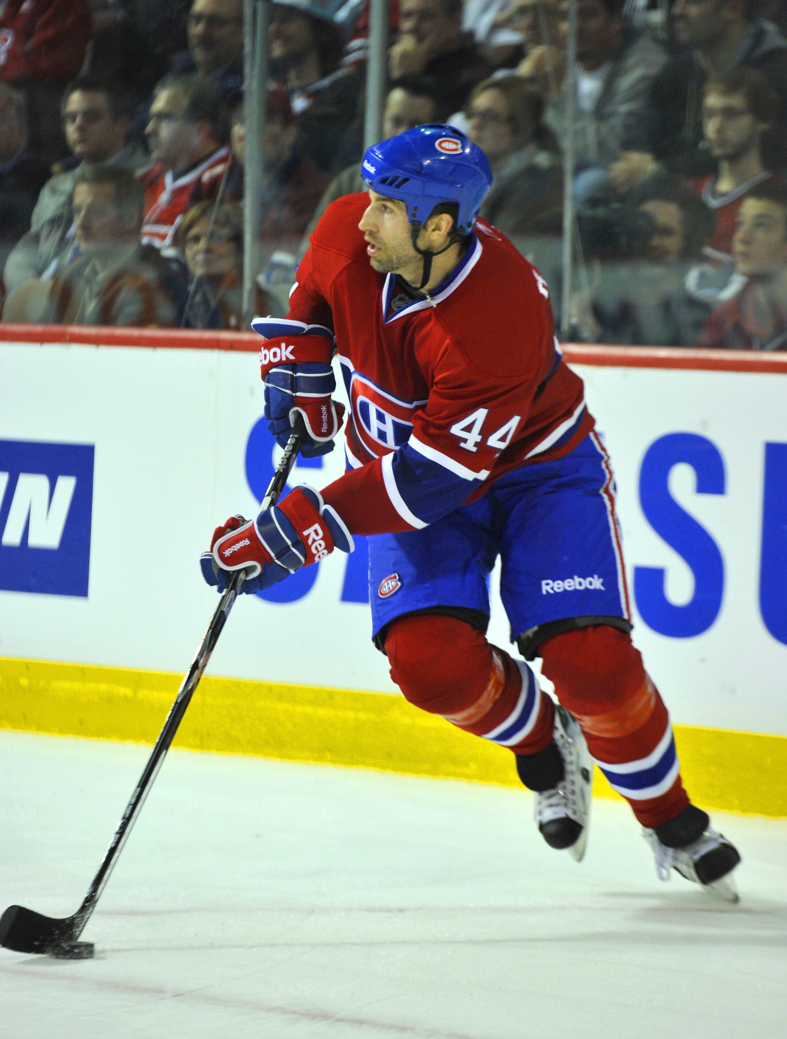 MONTREAL, CANADA - APRIL 18:  Roman Hamrlik #44 of the Montreal Canadiens turns up ice with the puck in Game Three of the Eastern Conference Quarterfinals against the Boston Bruins during the 2011 NHL Stanley Cup Playoffs at the Bell Centre on April 18, 2