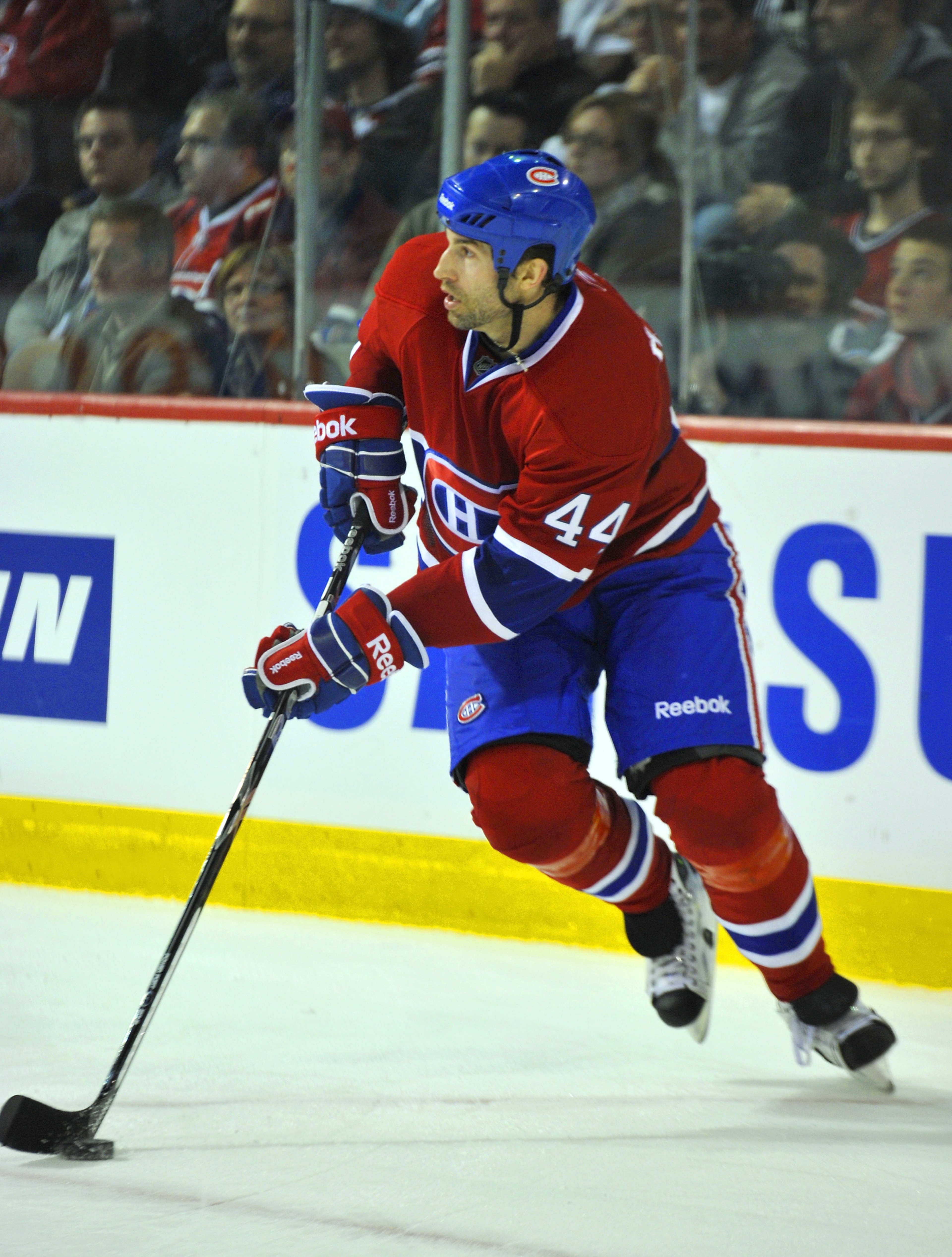 MONTREAL, CANADA - APRIL 18:  Roman Hamrlik #44 of the Montreal Canadiens turns up ice with the puck in Game Three of the Eastern Conference Quarterfinals against the Boston Bruins during the 2011 NHL Stanley Cup Playoffs at the Bell Centre on April 18, 2