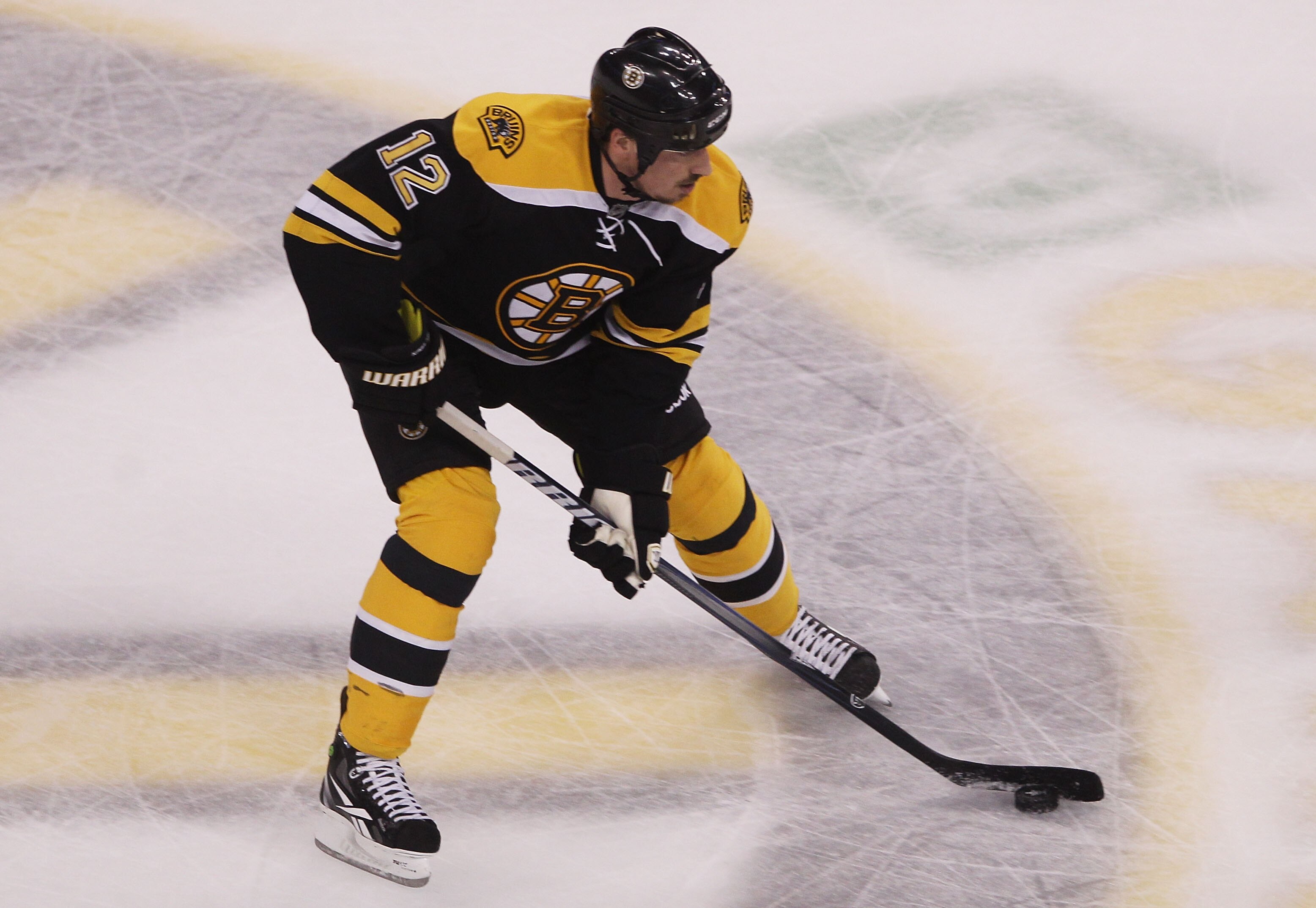 BOSTON, MA - MAY 23:  Tomas Kaberle #12 of the Boston Bruins controls the puck in Game Five of the Eastern Conference Finals against the Tampa Bay Lightning during the 2011 NHL Stanley Cup Playoffs at TD Garden on May 23, 2011 in Boston, Massachusetts.  (