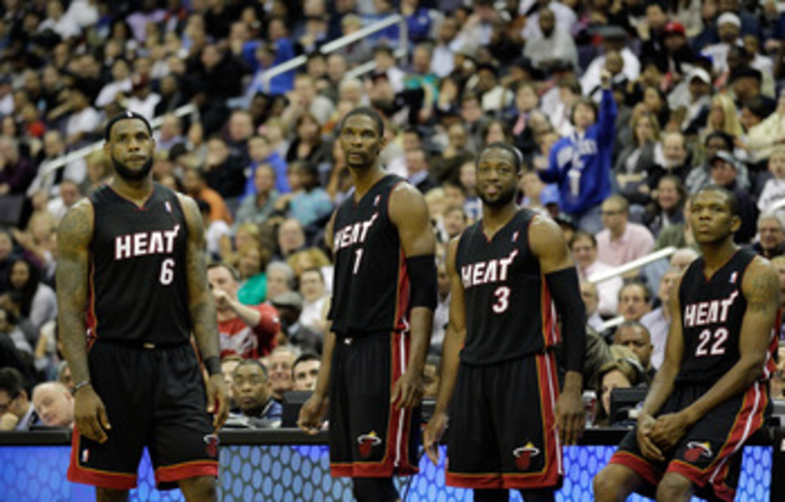 WASHINGTON, DC - MARCH 30:  LeBron James #6 of the Miami Heat stands with teammates Chris Bosh #1,  Dwyane Wade #3, and James Jones #22 against the Washington Wizards at the Verizon Center on March 30, 2011 in Washington, DC. NOTE TO USER: User expressly