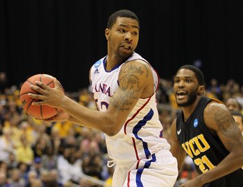 SAN ANTONIO, TX - MARCH 27: Marcus Morris #22 of the Kansas Jayhawks handles the ball against Jamie Skeen #21 of the Virginia Commonwealth Rams during the southwest regional final of the 2011 NCAA men's basketball tournament at the Alamodome on March 27, SAN ANTONIO, TX - MARCH 27: Marcus Morris #22 of the Kansas Jayhawks handles the ball against Jamie Skeen #21 of the Virginia Commonwealth Rams during the southwest regional final of the 2011 NCAA men's basketball tournament at the Alamodome on March 27,