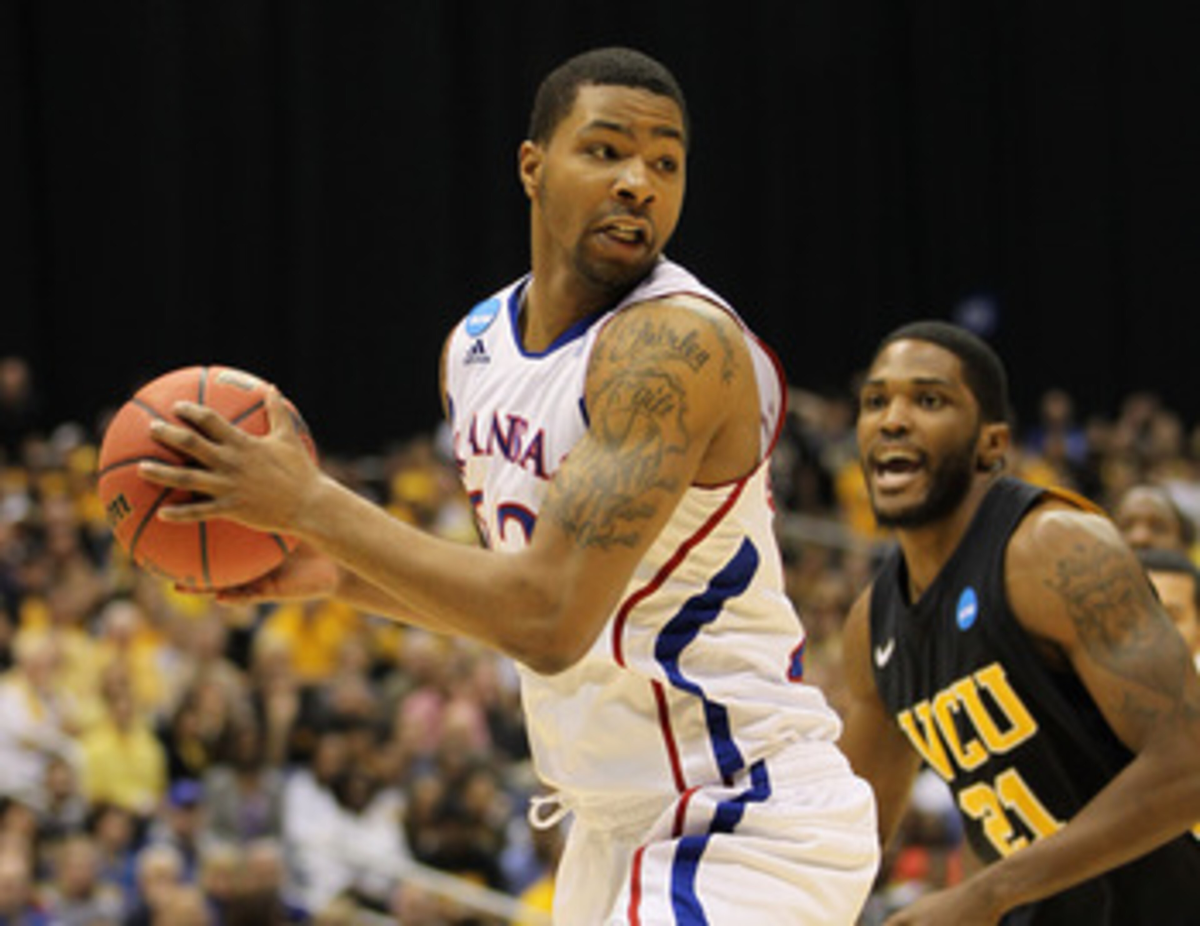 SAN ANTONIO, TX - MARCH 27: Marcus Morris #22 of the Kansas Jayhawks handles the ball against Jamie Skeen #21 of the Virginia Commonwealth Rams during the southwest regional final of the 2011 NCAA men's basketball tournament at the Alamodome on March 27, SAN ANTONIO, TX - MARCH 27: Marcus Morris #22 of the Kansas Jayhawks handles the ball against Jamie Skeen #21 of the Virginia Commonwealth Rams during the southwest regional final of the 2011 NCAA men's basketball tournament at the Alamodome on March 27,