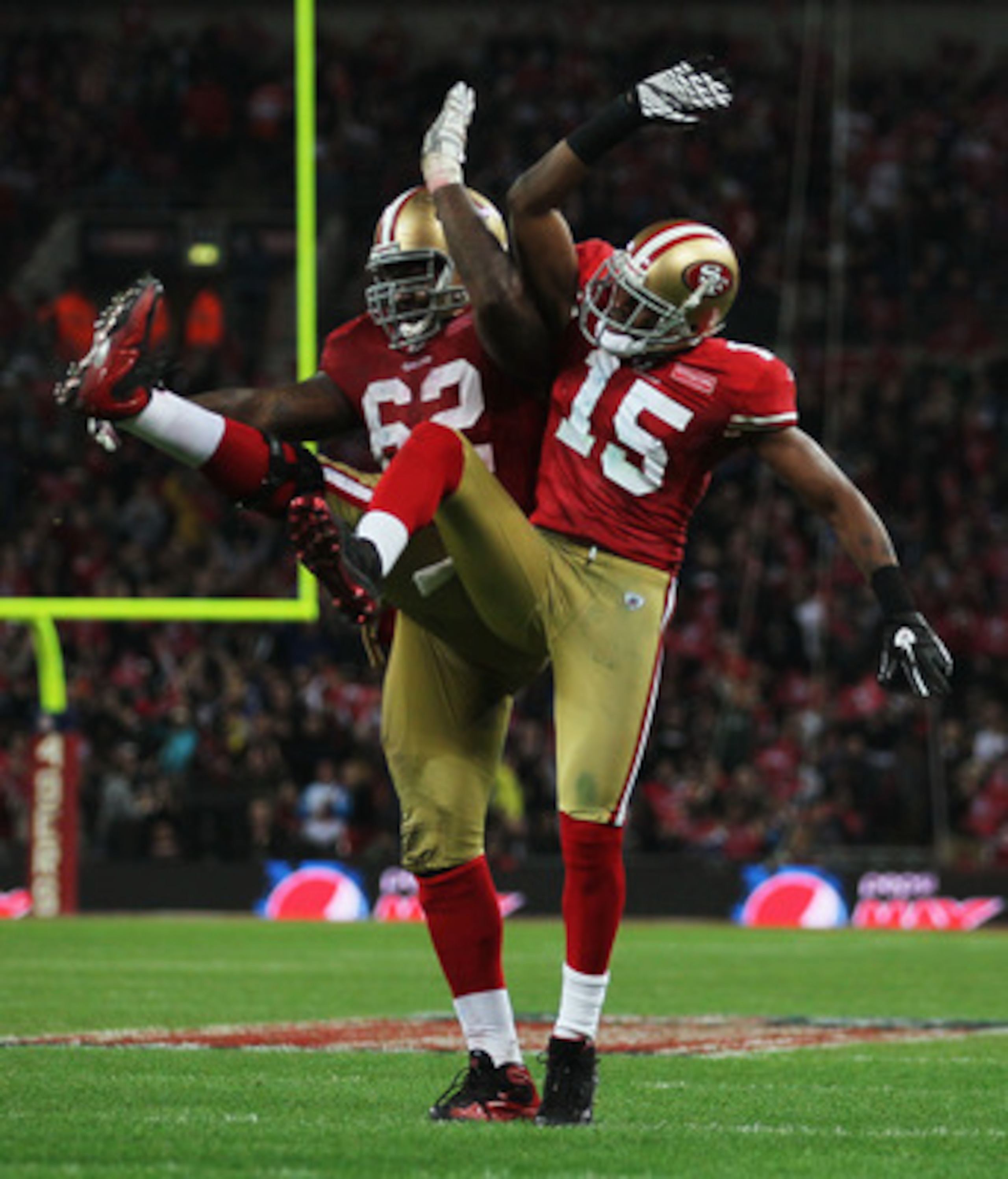 LONDON, ENGLAND - OCTOBER 31:  Michael Crabtree #15 of San Francisco 49ers celebrates with  Chilo Rachal #62 as he scores their second touchdown during the NFL International Series match between Denver Broncos and San Francisco 49ers at Wembley Stadium on