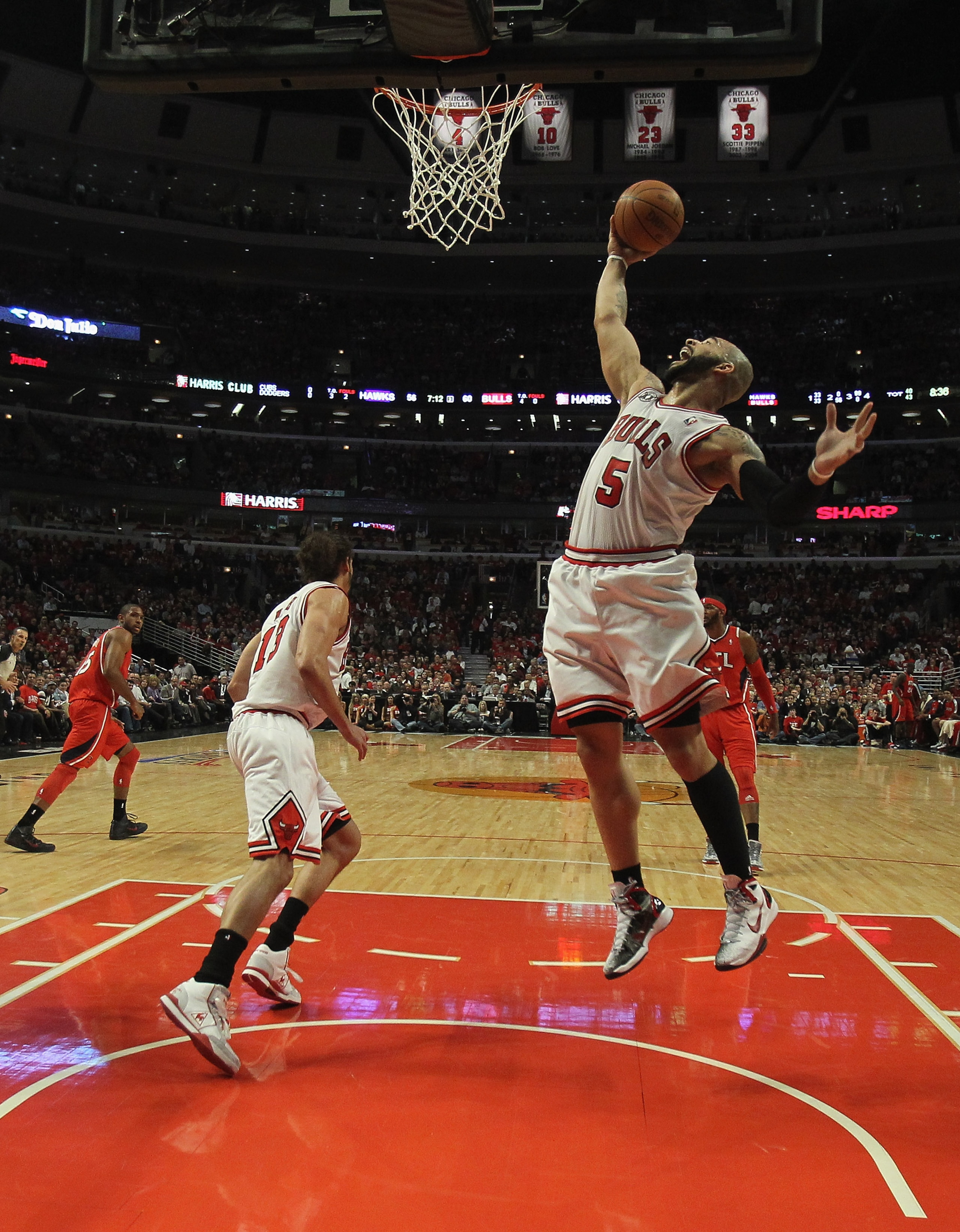 CHICAGO, IL - MAY 02: Carlos Boozer #5 of the Chicago Bulls grabs a rebound against the Atlanta Hawks in Game One of the Eastern Conference Semifinals in the 2011 NBA Playoffs at the United Center on May 2, 2011 in Chicago, Illinois. The Hawks defeated th
