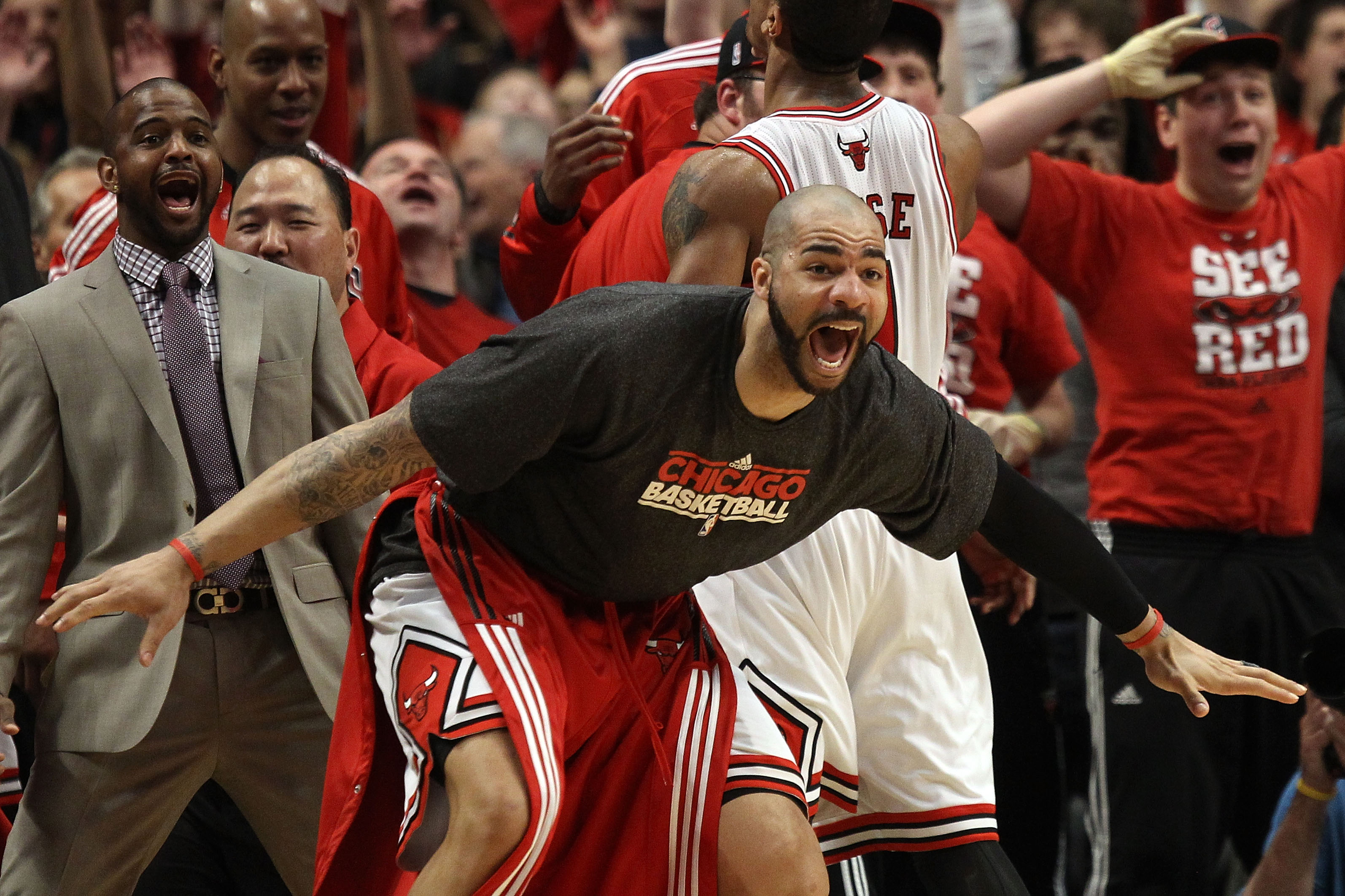 CHICAGO, IL - MAY 15:  Carlos Boozer #5 of the Chicago Bulls celebrates on the bench against the Miami Heat in Game One of the Eastern Conference Finals during the 2011 NBA Playoffs on May 15, 2011 at the United Center in Chicago, Illinois. NOTE TO USER: