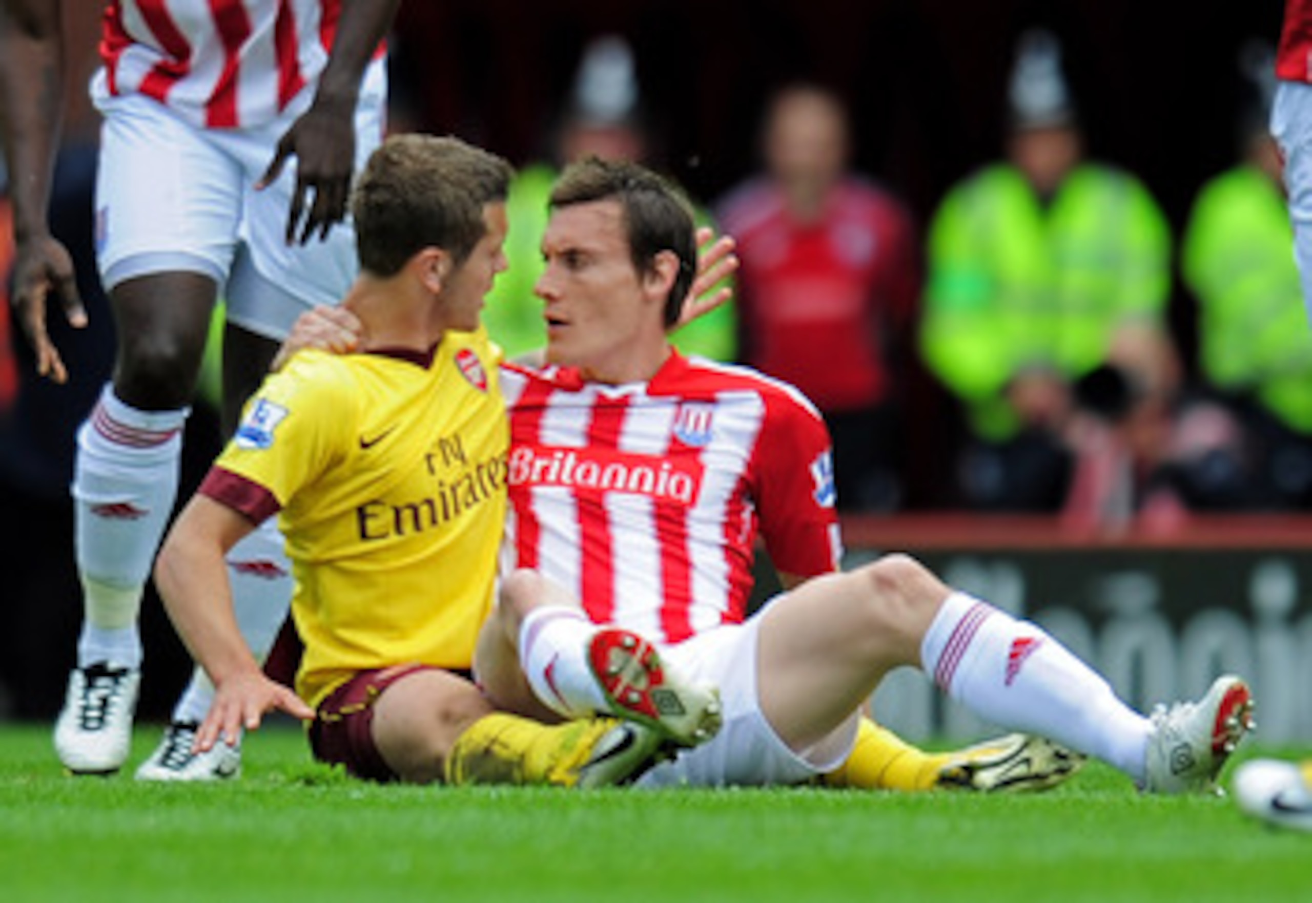 STOKE ON TRENT, ENGLAND - MAY 08:  Jack Wilshere of Arsenal and Dean Whitehead of Stoke clash during the Barclays Premier League match between Stoke City and Arsenal at the Britannia Stadium on May 8, 2011 in Stoke on Trent, England.  (Photo by Shaun Bott