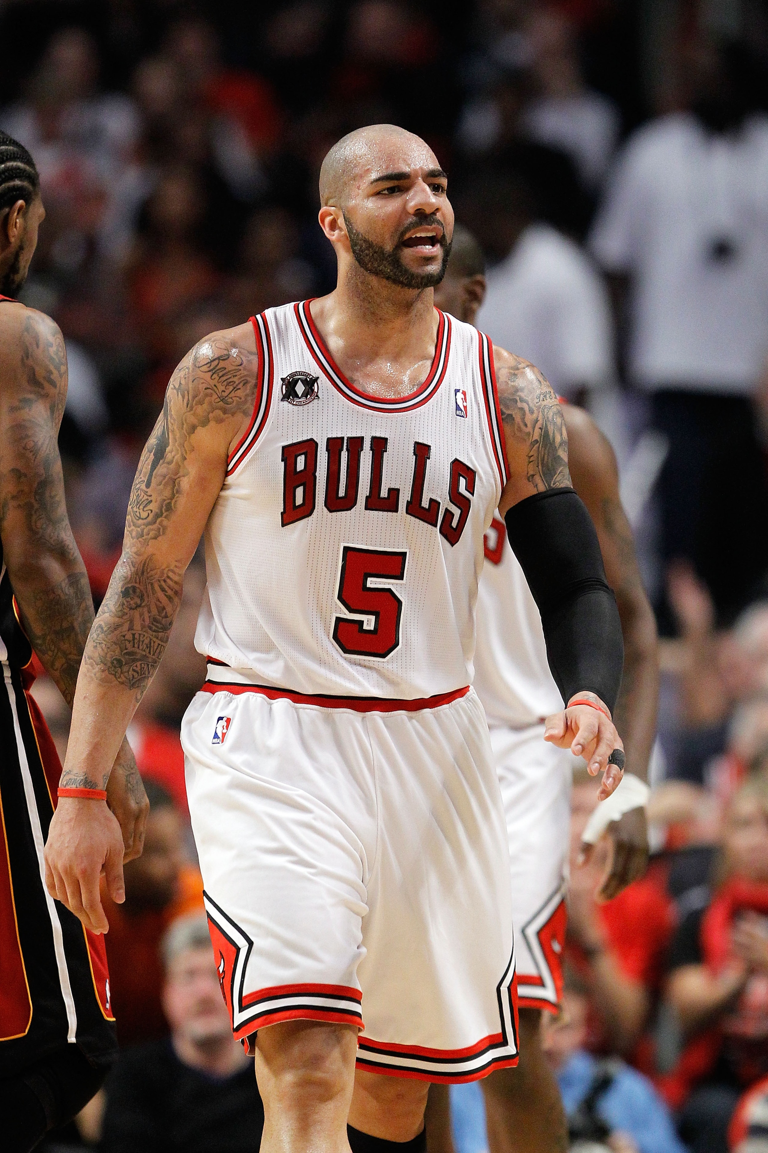 CHICAGO, IL - MAY 18:  Carlos Boozer #5 of the Chicago Bulls looks on against the Miami Heat in Game Two of the Eastern Conference Finals during the 2011 NBA Playoffs on May 18, 2011 at the United Center in Chicago, Illinois. The Heat won 85-75. NOTE TO U