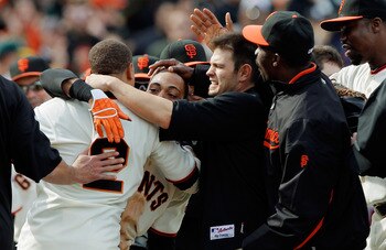 SAN FRANCISCO, CA - MAY 22: Darren Ford #34 of the San Francisco Giants gets mobbed after scoring the winning run on a single by Emmanuel Burriss #2 against the Oakland A's in the 11th inning at AT&T Park on May 22, 2011 in San Francisco, California. The