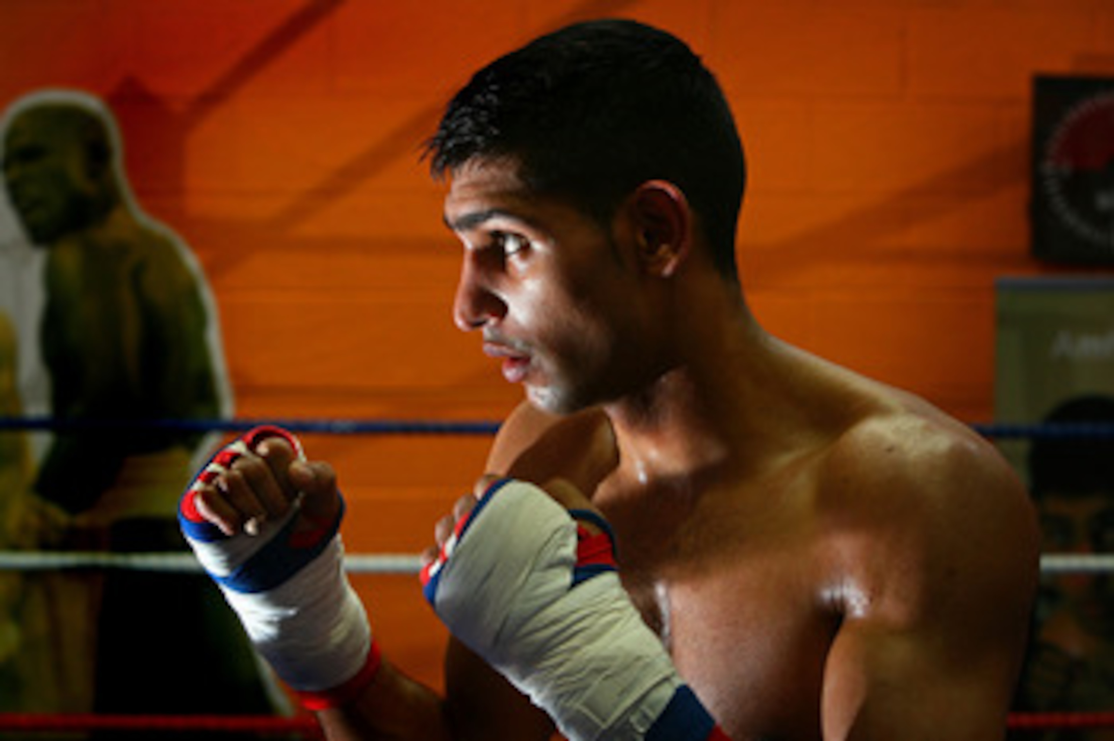 BOLTON, UNITED KINGDOM - MARCH 27:  Commonwealth Lightweight Champion Amir Khan works out in front of the media in his training gym  on March 27, 2008 in Bolton, England. Kahn held his open workout in the lead up to his next fight against Martin Kristanse
