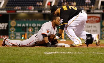 PITTSBURGH - APRIL 26:  Darren Ford #34 of the San Francisco Giants slides safely into third base past the tag of Pedro Alvarez #24 of the Pittsburgh Pirates during the game on April 26, 2011 at PNC Park in Pittsburgh, Pennsylvania.  (Photo by Jared Wicke