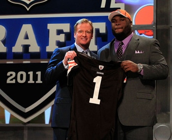 NEW YORK, NY - APRIL 28: NFL Commissioner Roger Goodell (L) poses for a photo with Phil Taylor, #21 overall pick by the Cleveland Browns, on stage during the 2011 NFL Draft at Radio City Music Hall on April 28, 2011 in New York City. (Photo by Chris Tro NEW YORK, NY - APRIL 28: NFL Commissioner Roger Goodell (L) poses for a photo with Phil Taylor, #21 overall pick by the Cleveland Browns, on stage during the 2011 NFL Draft at Radio City Music Hall on April 28, 2011 in New York City. (Photo by Chris Tro