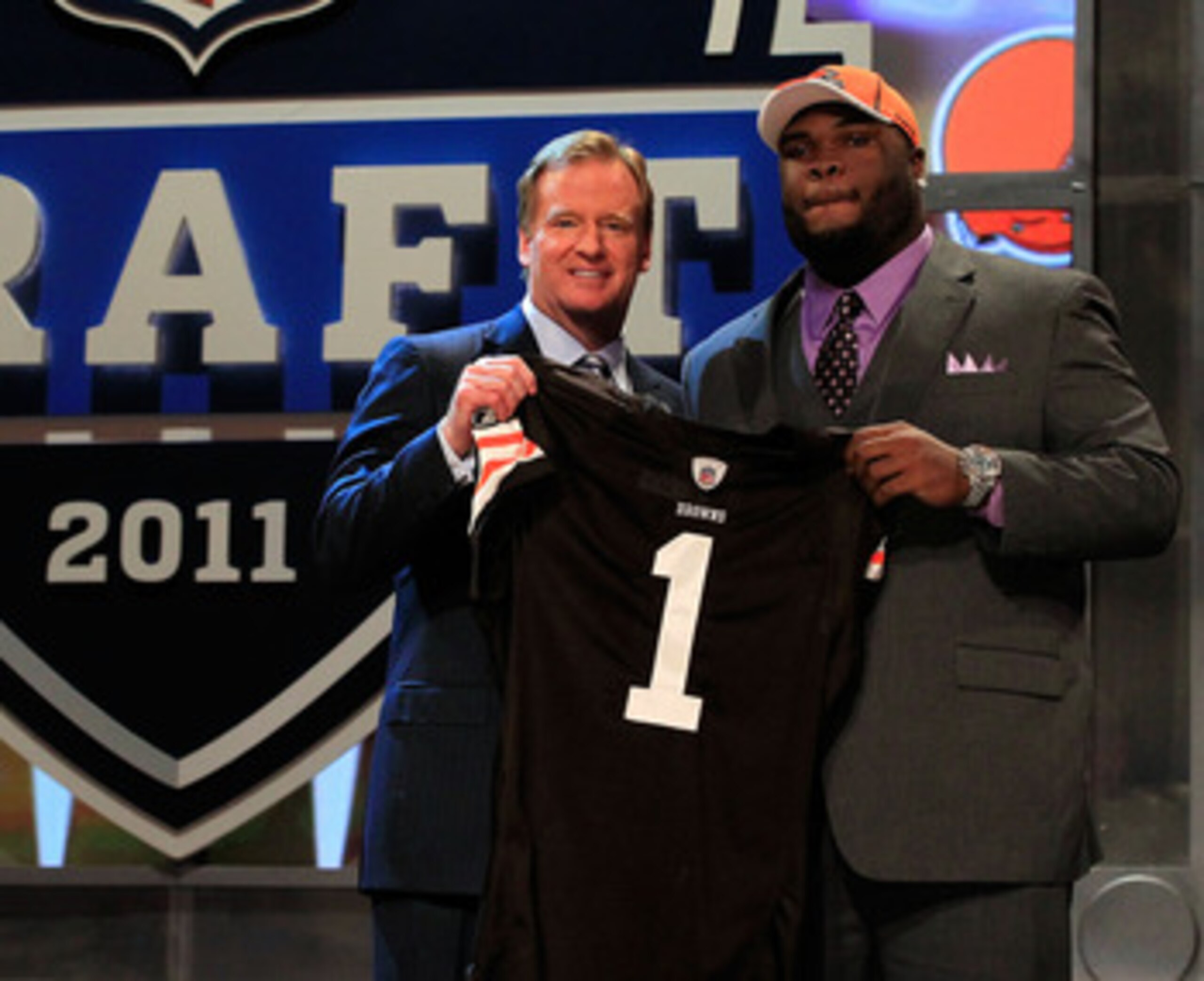 NEW YORK, NY - APRIL 28:  NFL Commissioner Roger Goodell (L) poses for a photo with Phil Taylor, #21 overall pick by the Cleveland Browns, on stage during the 2011 NFL Draft at Radio City Music Hall on April 28, 2011 in New York City.  (Photo by Chris Tro