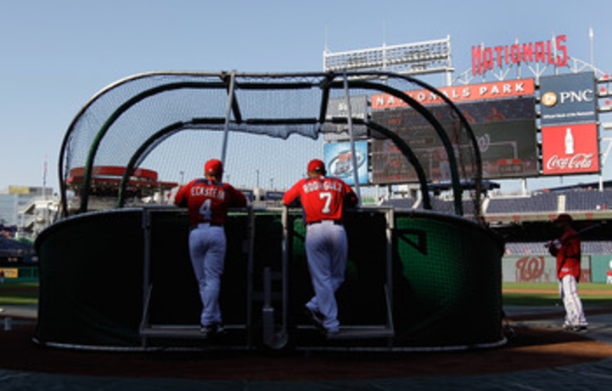 WASHINGTON, DC - APRIL 14: Hitting coach Rick Eckstein #4 and Ivan Rodriguez #7 of the Washington Nationals watch batting practice before the start of their game against the Philadelphia Phillies at Nationals Park on April 14, 2011 in Washington, DC. (P WASHINGTON, DC - APRIL 14: Hitting coach Rick Eckstein #4 and Ivan Rodriguez #7 of the Washington Nationals watch batting practice before the start of their game against the Philadelphia Phillies at Nationals Park on April 14, 2011 in Washington, DC. (P