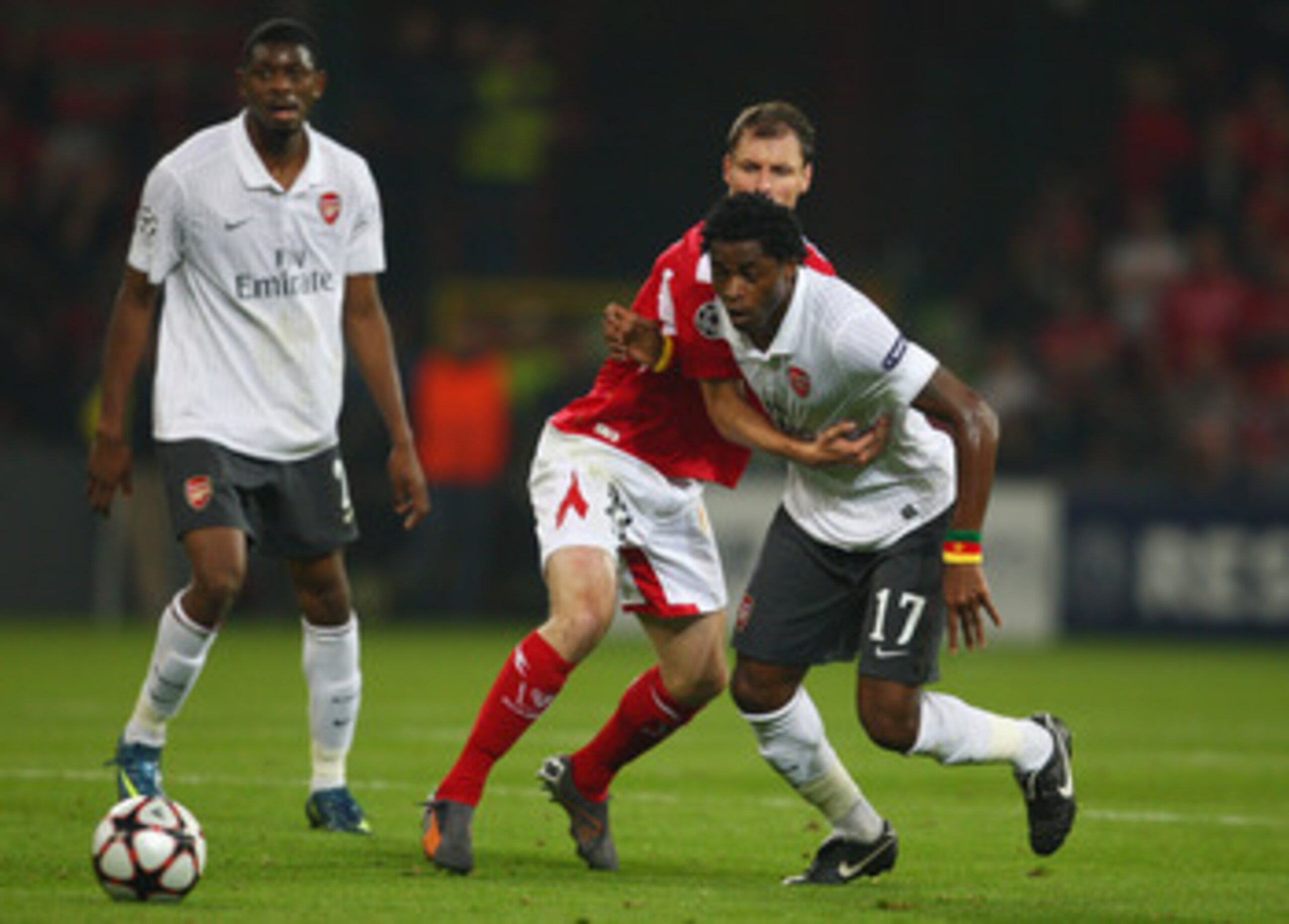 LIEGE, BELGIUM - SEPTEMBER 16:  Alexandre Song of Arsenal battles with Axel Witsel of Standard Liege during the UEFA Champions League Group H match between Standard Liege and Arsenal at the Sclessin Stadium on September 16, 2009 in Liege, Belgium.  (Photo