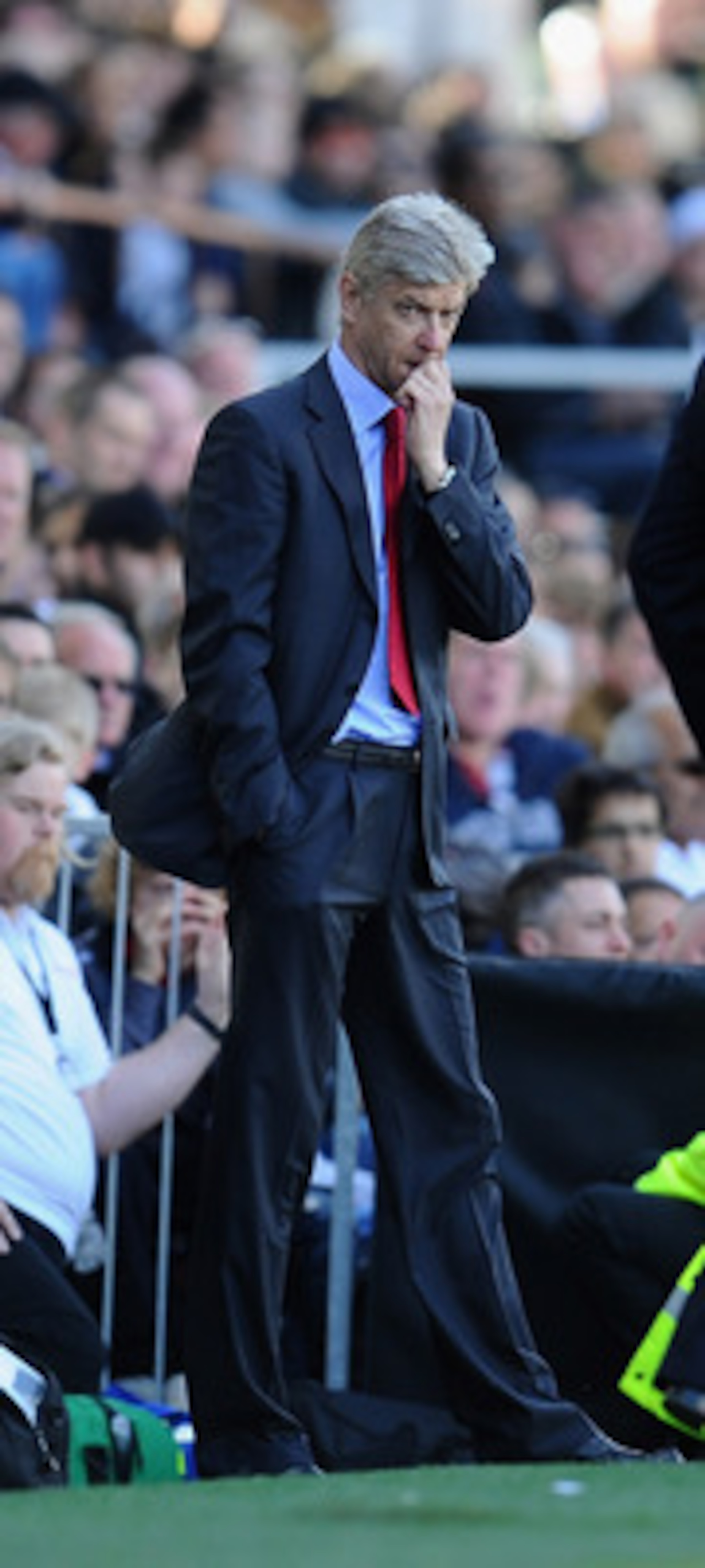 LONDON, ENGLAND - MAY 22: Arsene Wenger of Arsenal shows his emotions as Mark Hughes of Fulham looks on during the Barclays Premier League match between Fulham and Arsenal at Craven Cottage on May 22, 2011 in London, England. (Photo by Clive Mason/Getty LONDON, ENGLAND - MAY 22: Arsene Wenger of Arsenal shows his emotions as Mark Hughes of Fulham looks on during the Barclays Premier League match between Fulham and Arsenal at Craven Cottage on May 22, 2011 in London, England. (Photo by Clive Mason/Getty