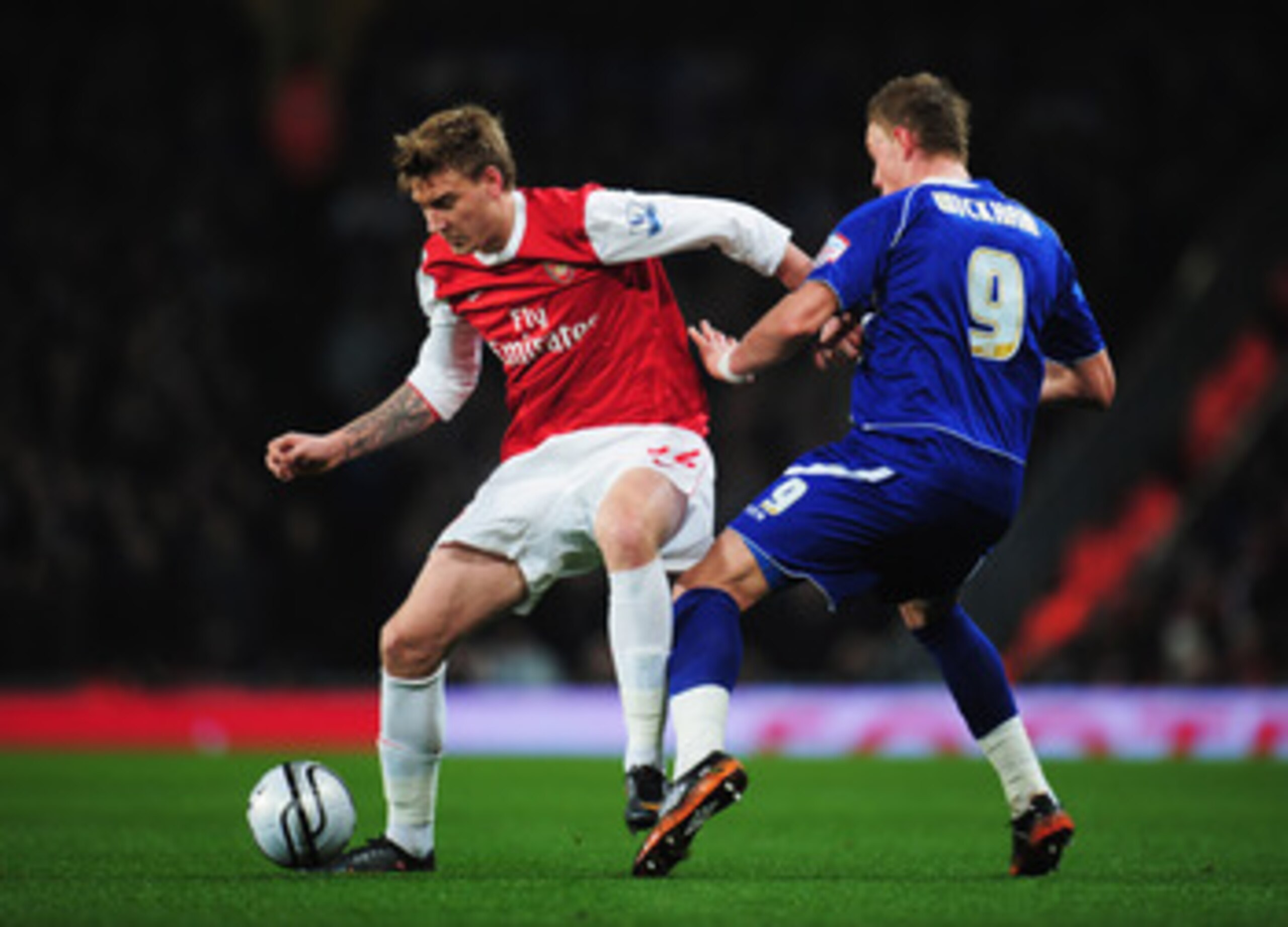 LONDON, ENGLAND - JANUARY 25:  Nicklas Bendtner of Arsenal holds off Connor Wickham of Ipswich Town during the Carling Cup Semi Final Second Leg match between Arsenal and Ipswich Town at Emirates Stadium on January 25, 2011 in London, England.  (Photo by