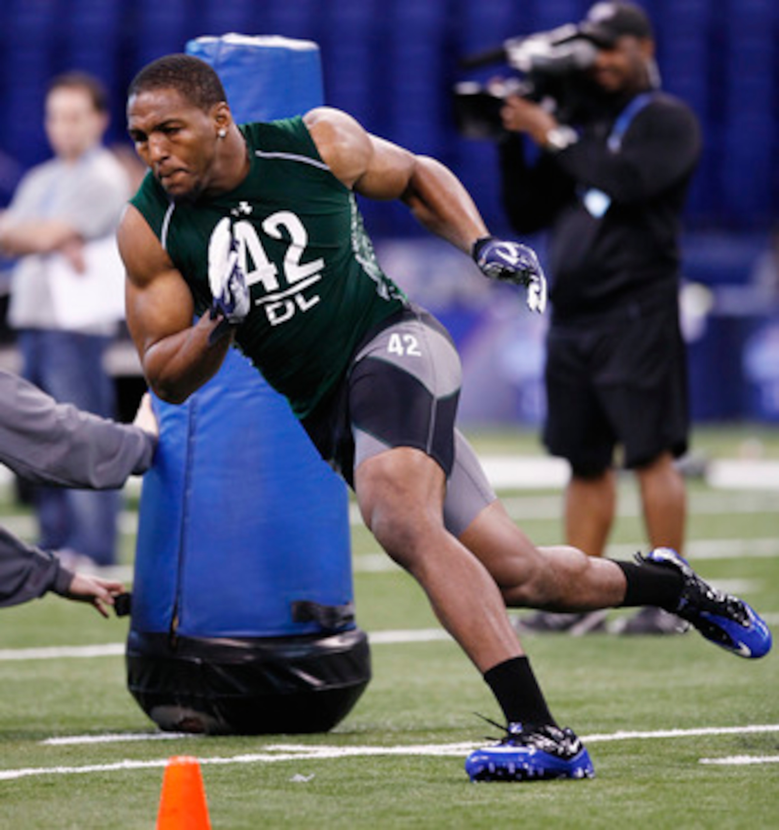 INDIANAPOLIS, IN - FEBRUARY 28:  Defensive lineman Robert Quinn of North Carolina runs through a drill during the 2011 NFL Scouting Combine at Lucas Oil Stadium on February 28, 2011 in Indianapolis, Indiana. (Photo by Joe Robbins/Getty Images)